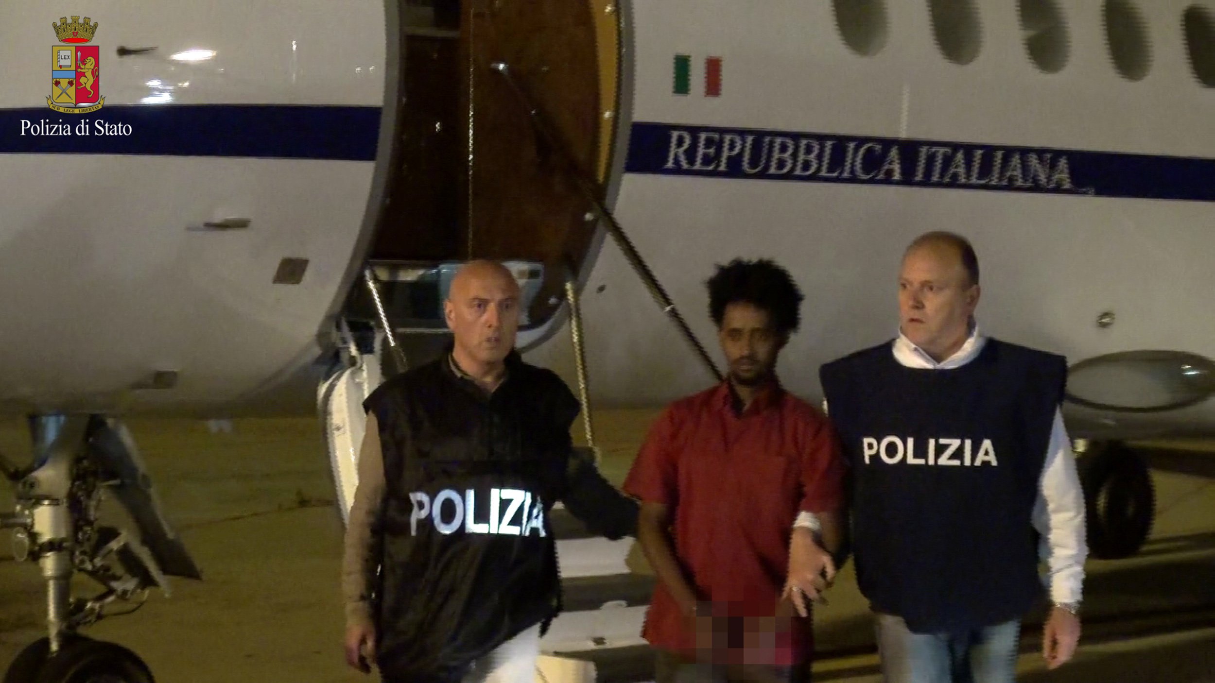 Italian police with smuggling suspect.