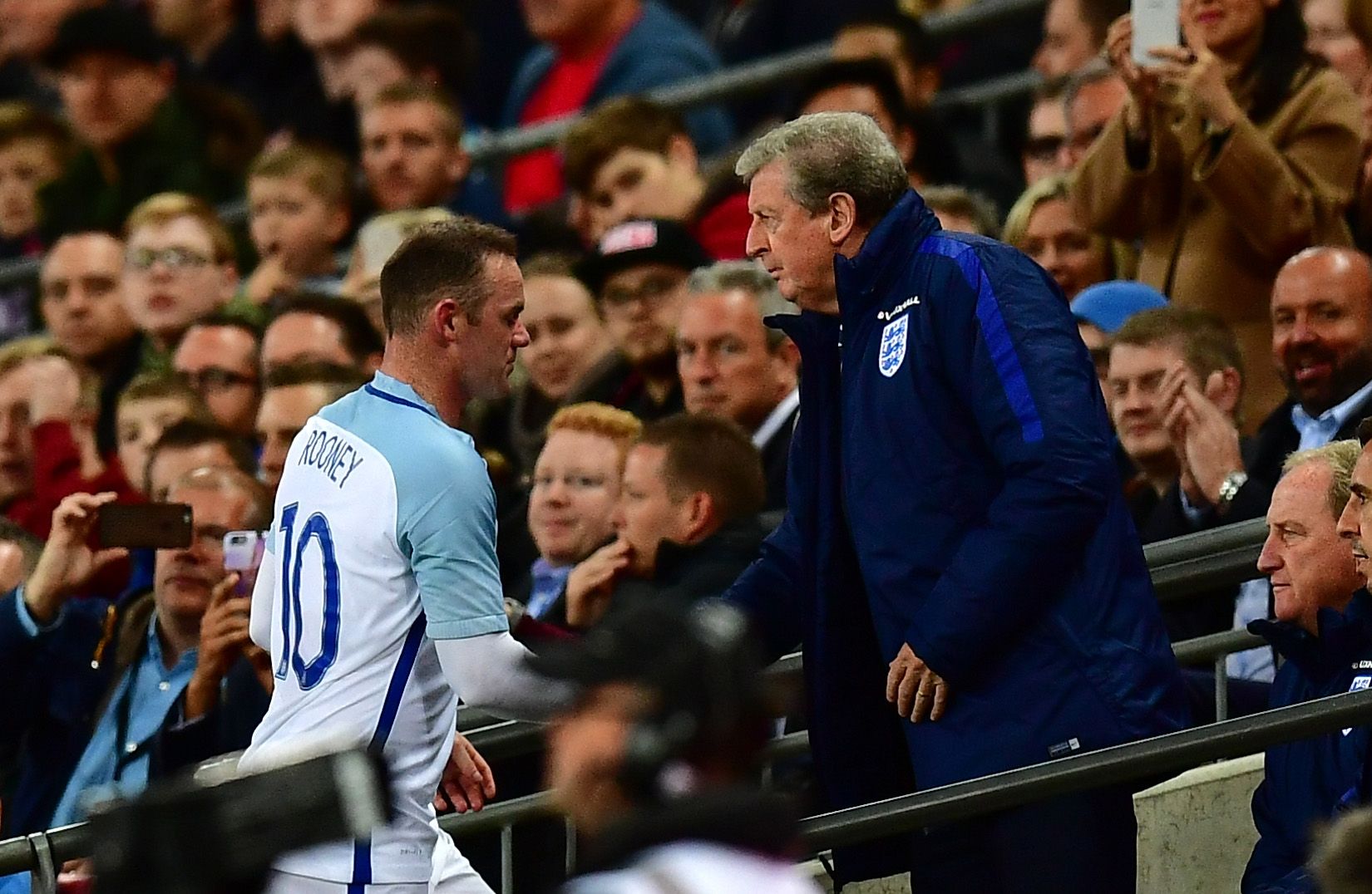 England captain Wayne Rooney, left, with Roy Hodgson.