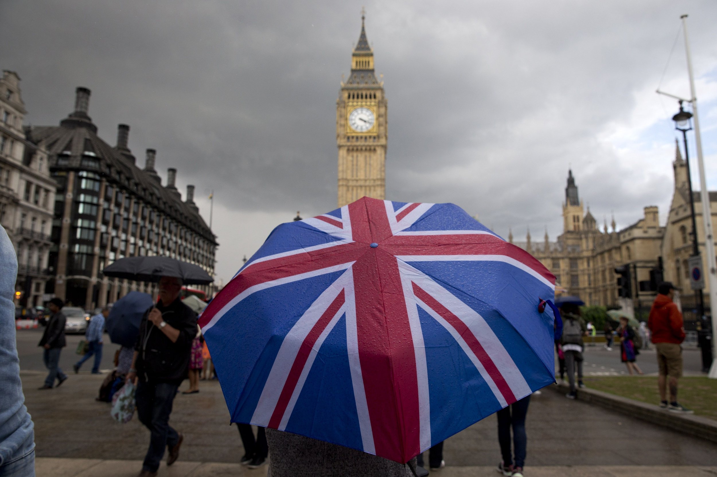 Pedestrian under Union Jack umbrella