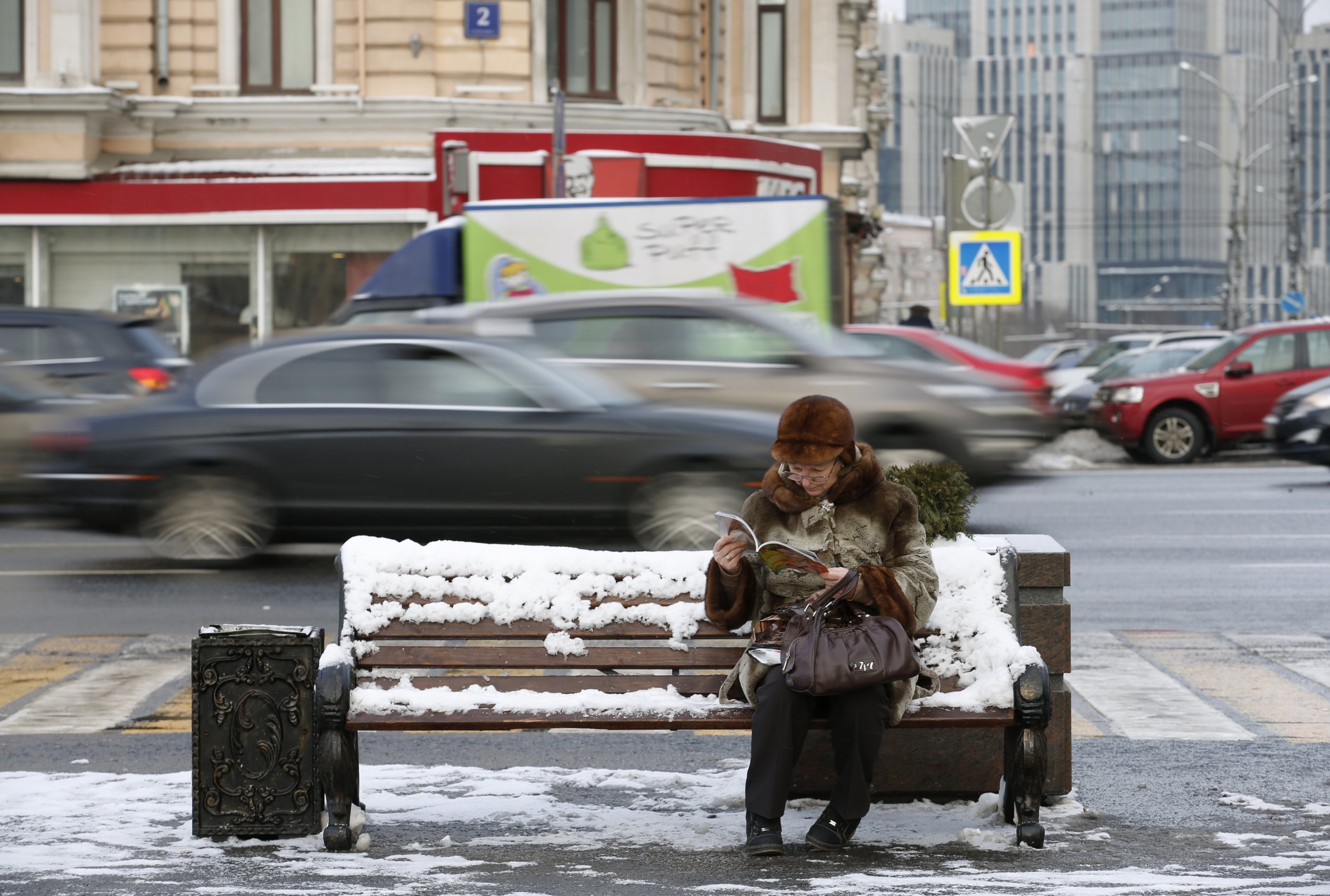 Woman reads magazine in Moscow