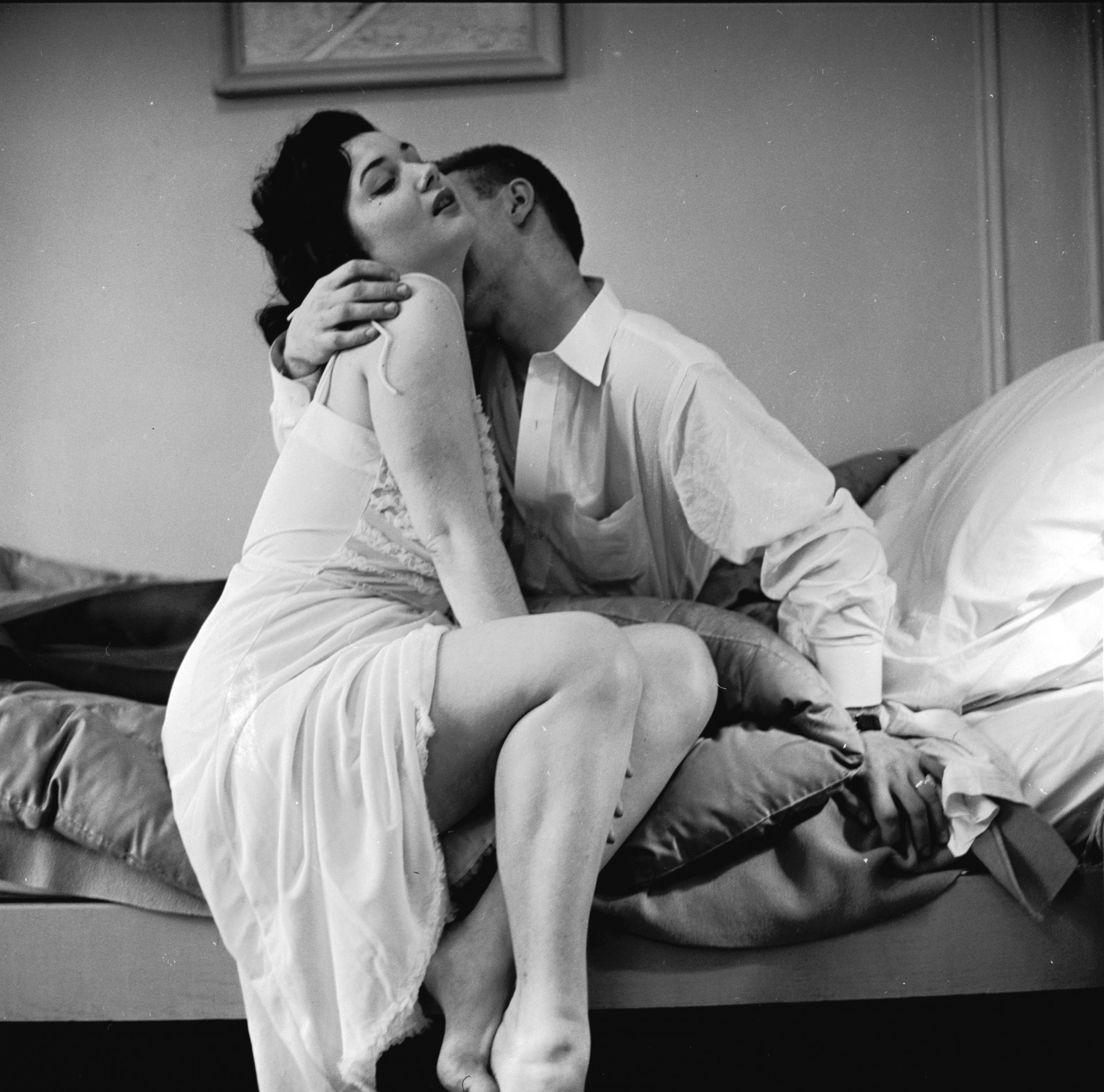 A couple engaged in a passionate embrace, circa 1955. 