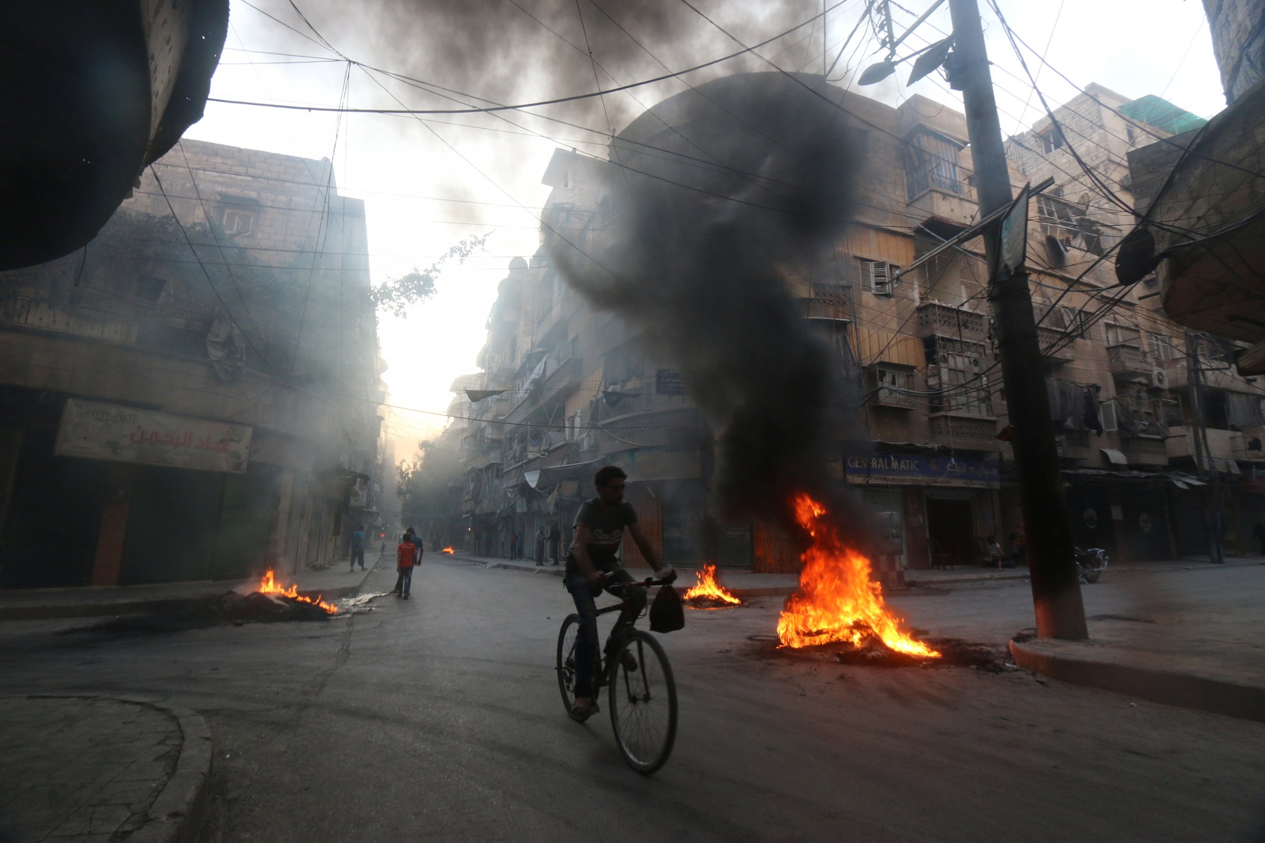 Tires burn in Aleppo