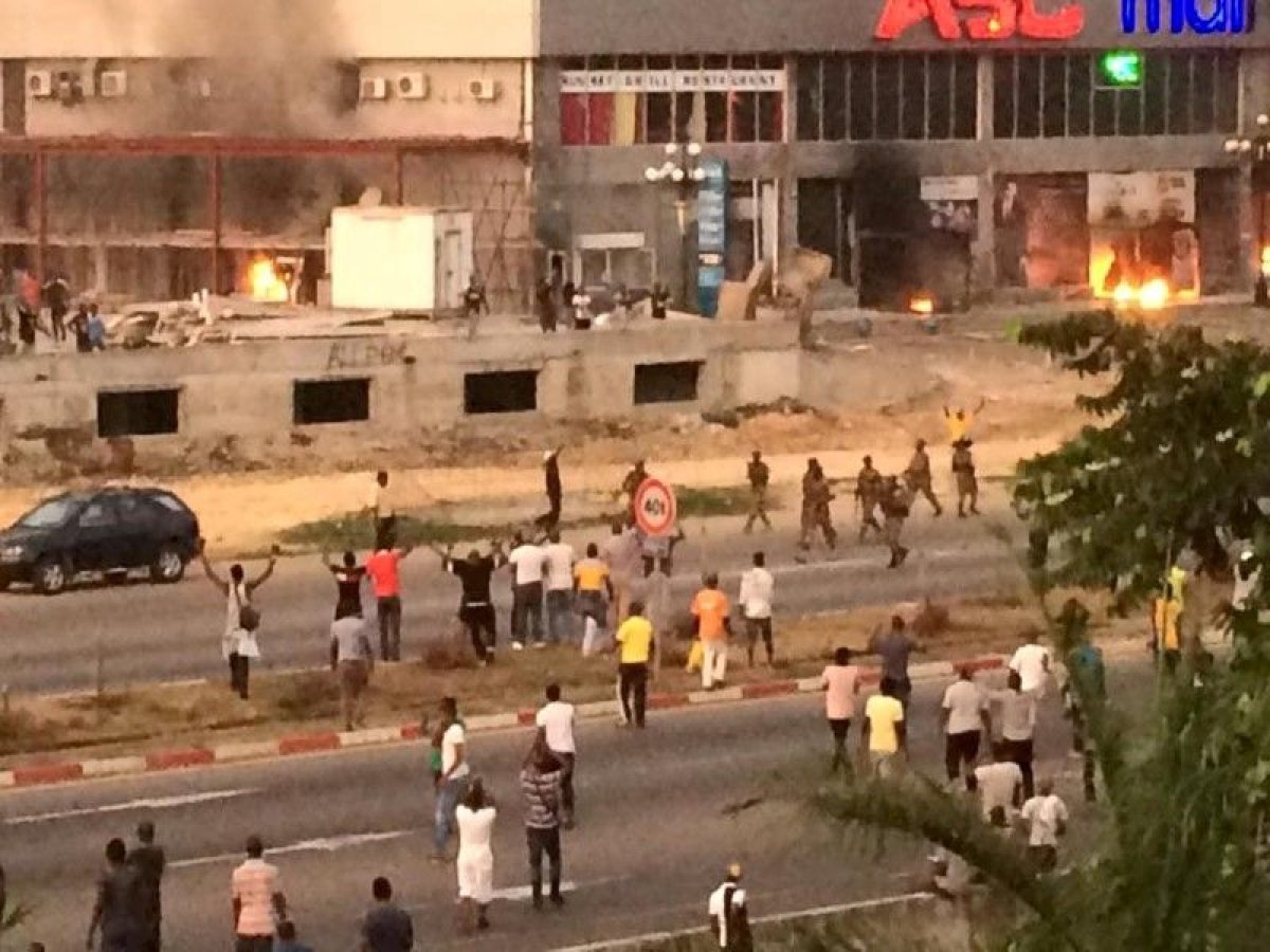 Gabon soldiers patrol a street near opposition HQ