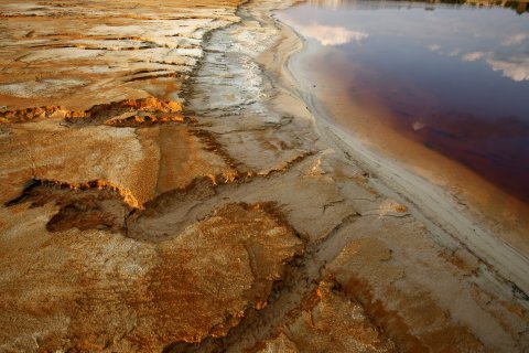 Polluted water fills a dam near Johannesburg