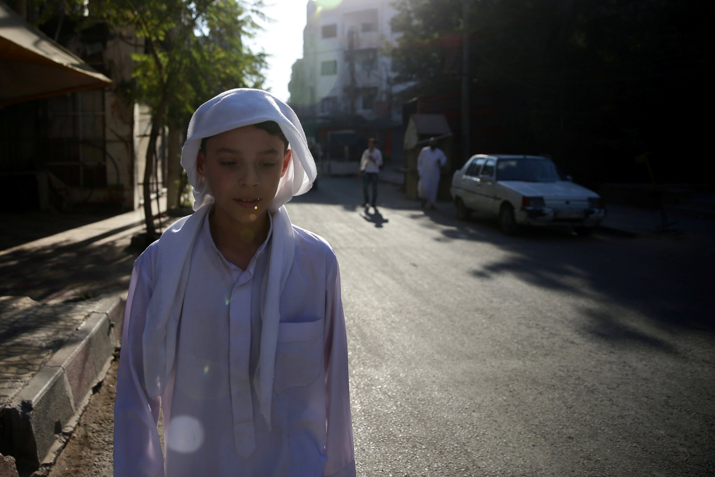 Syria boy walks in Douma