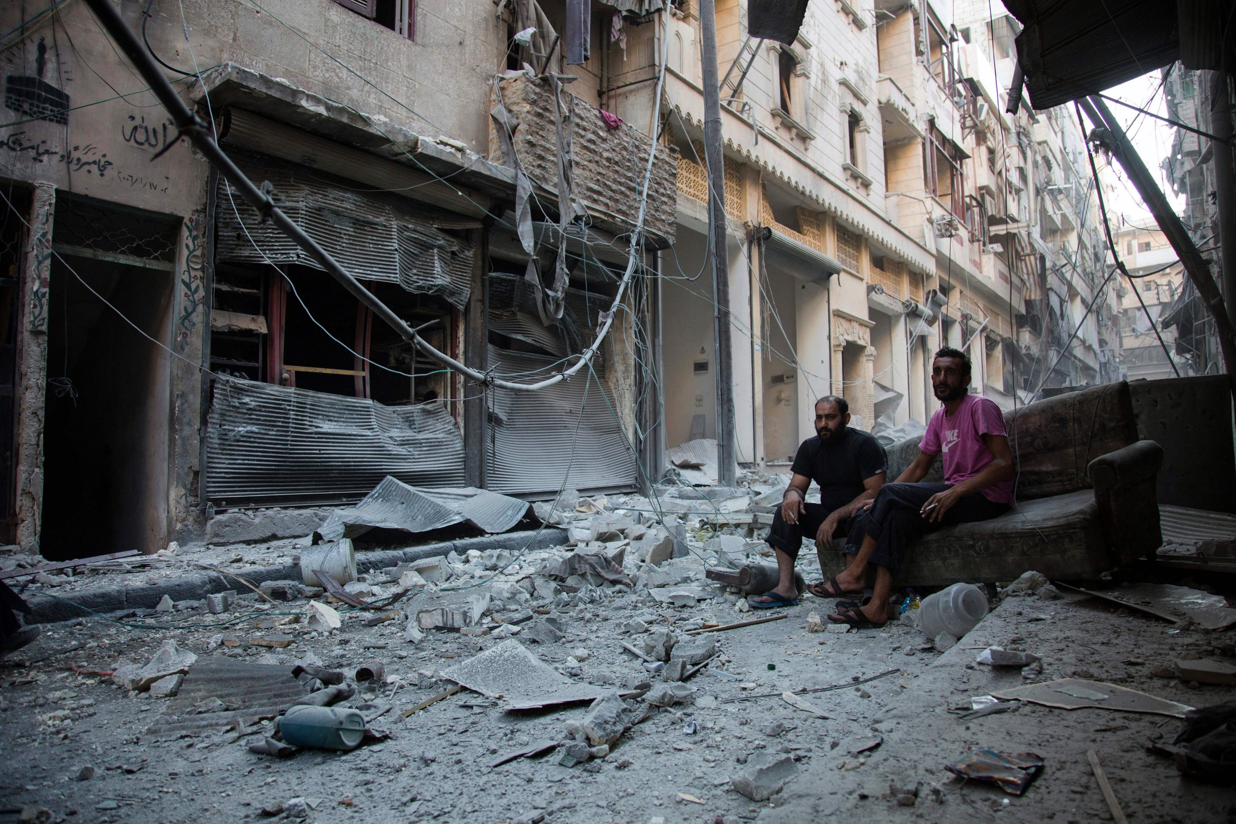 Syria men in Aleppo before ceasefire expiration