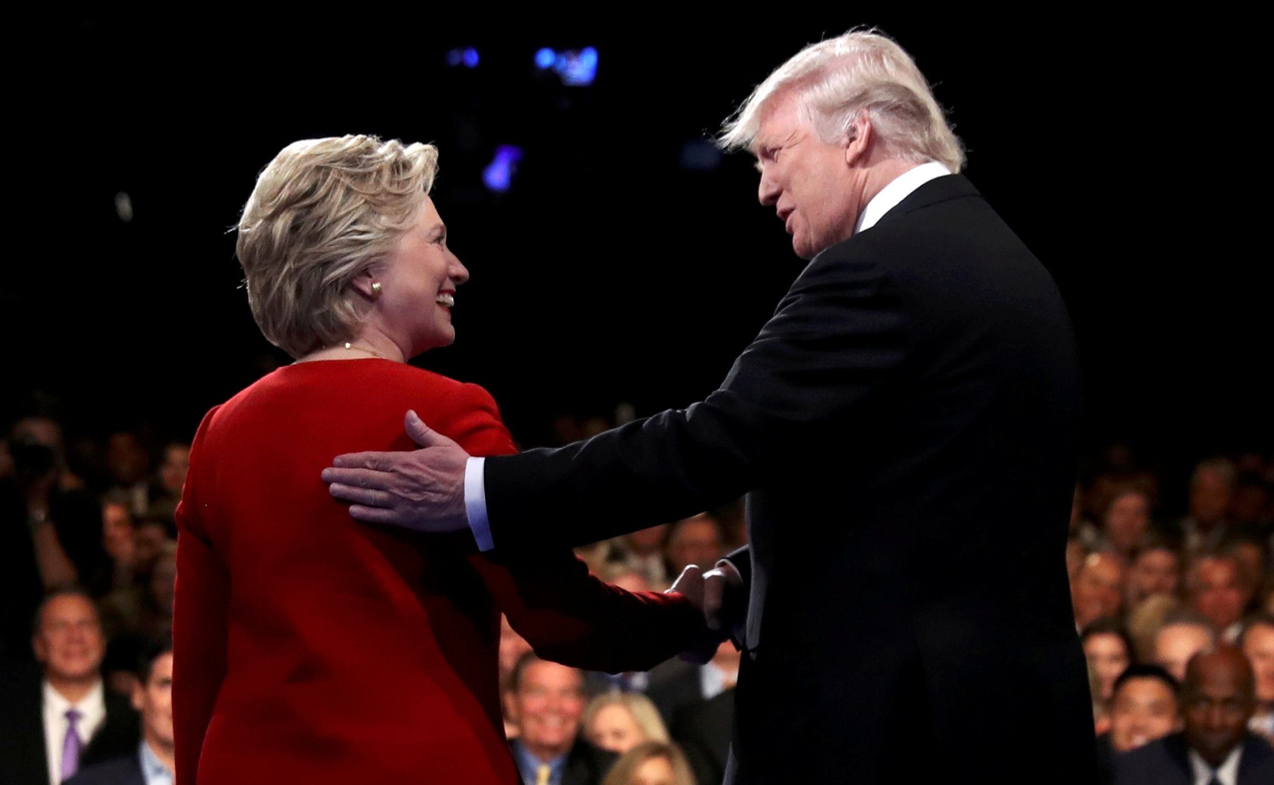 Hillary Clinton shakes hands with Donald Trump 