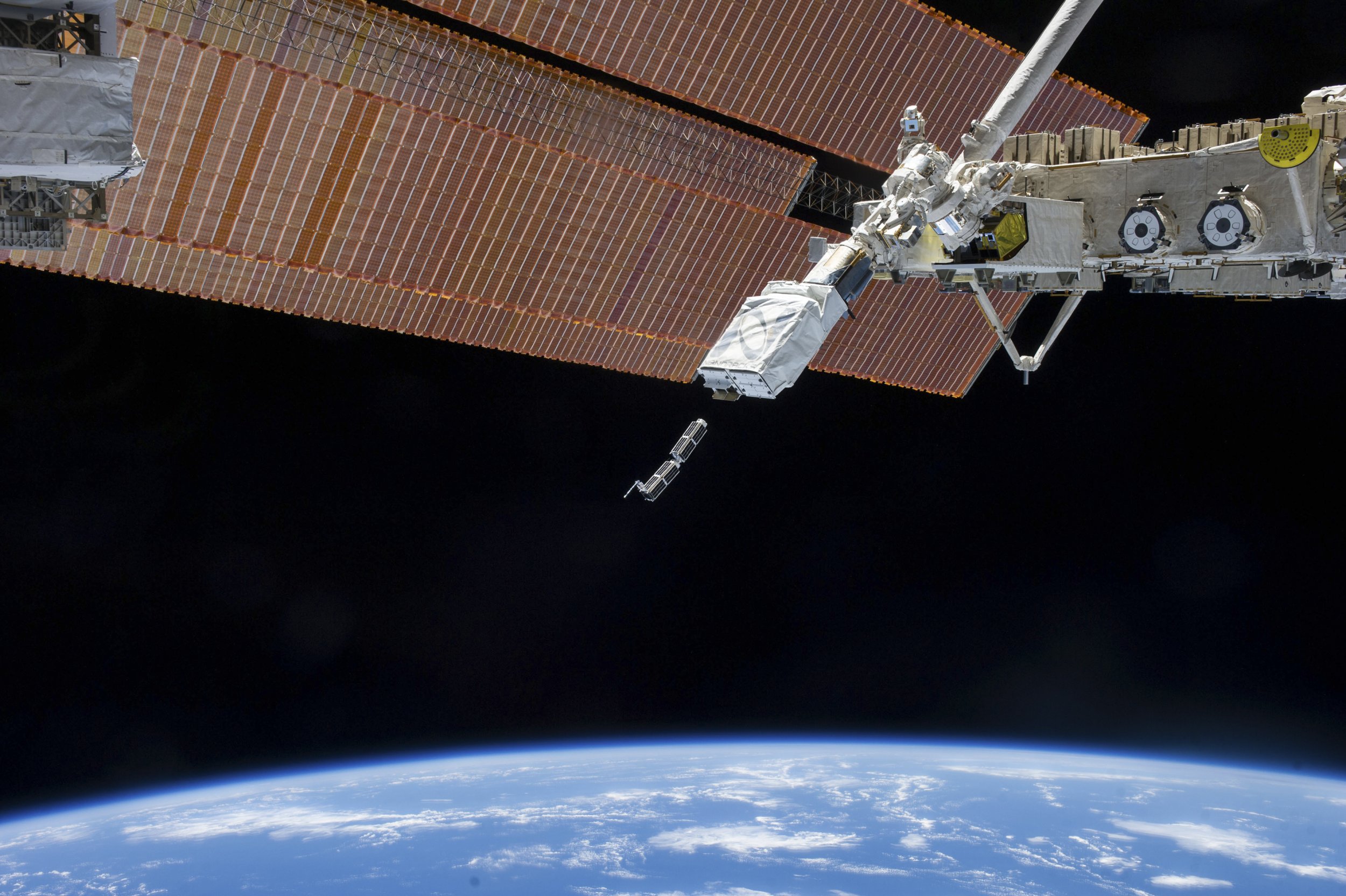 Small Satellite Orbital Deployer in space with CubeSats
