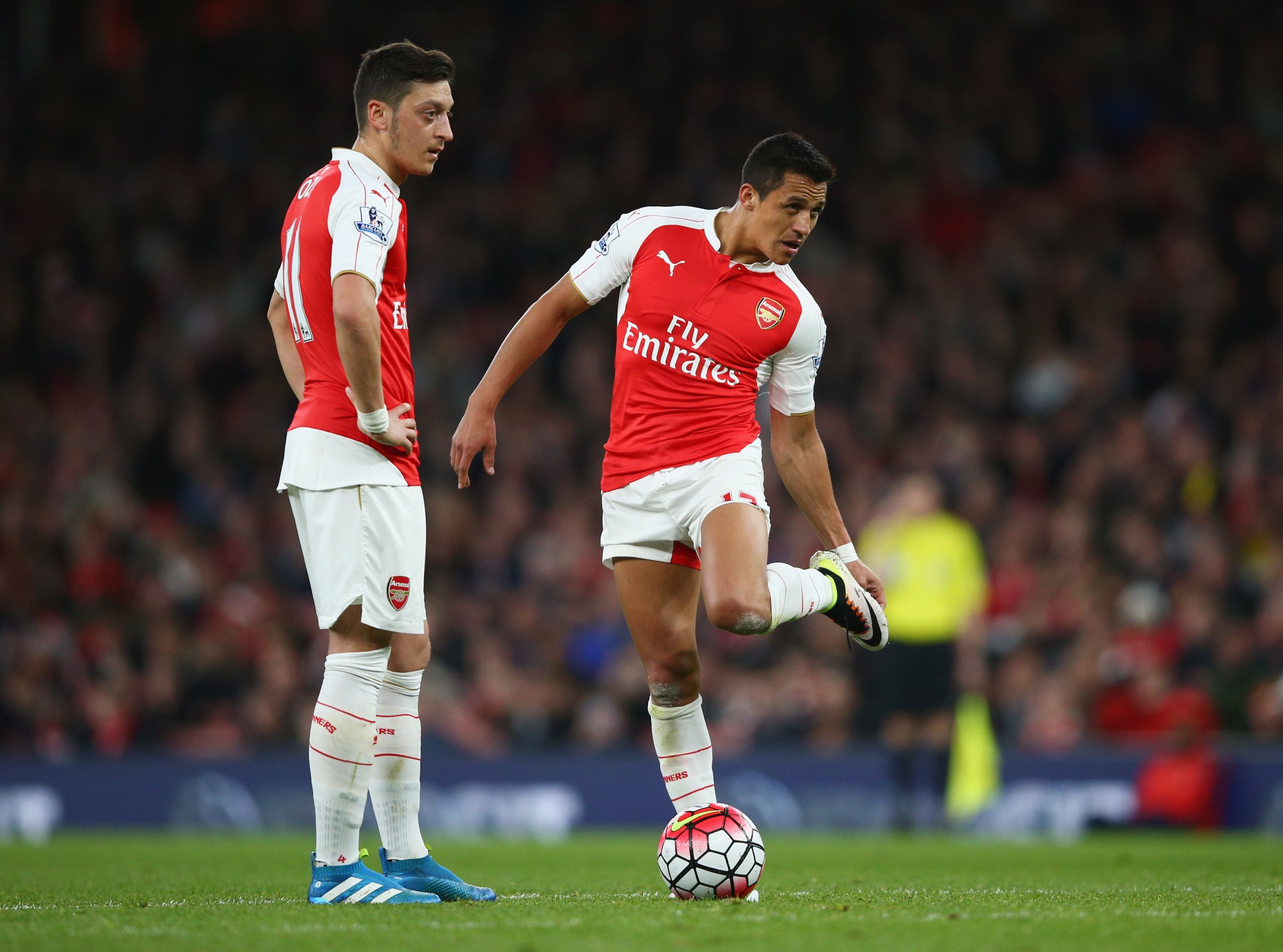 Mesut Ozil, left, with Arsenal teammate Alexis Sanchez