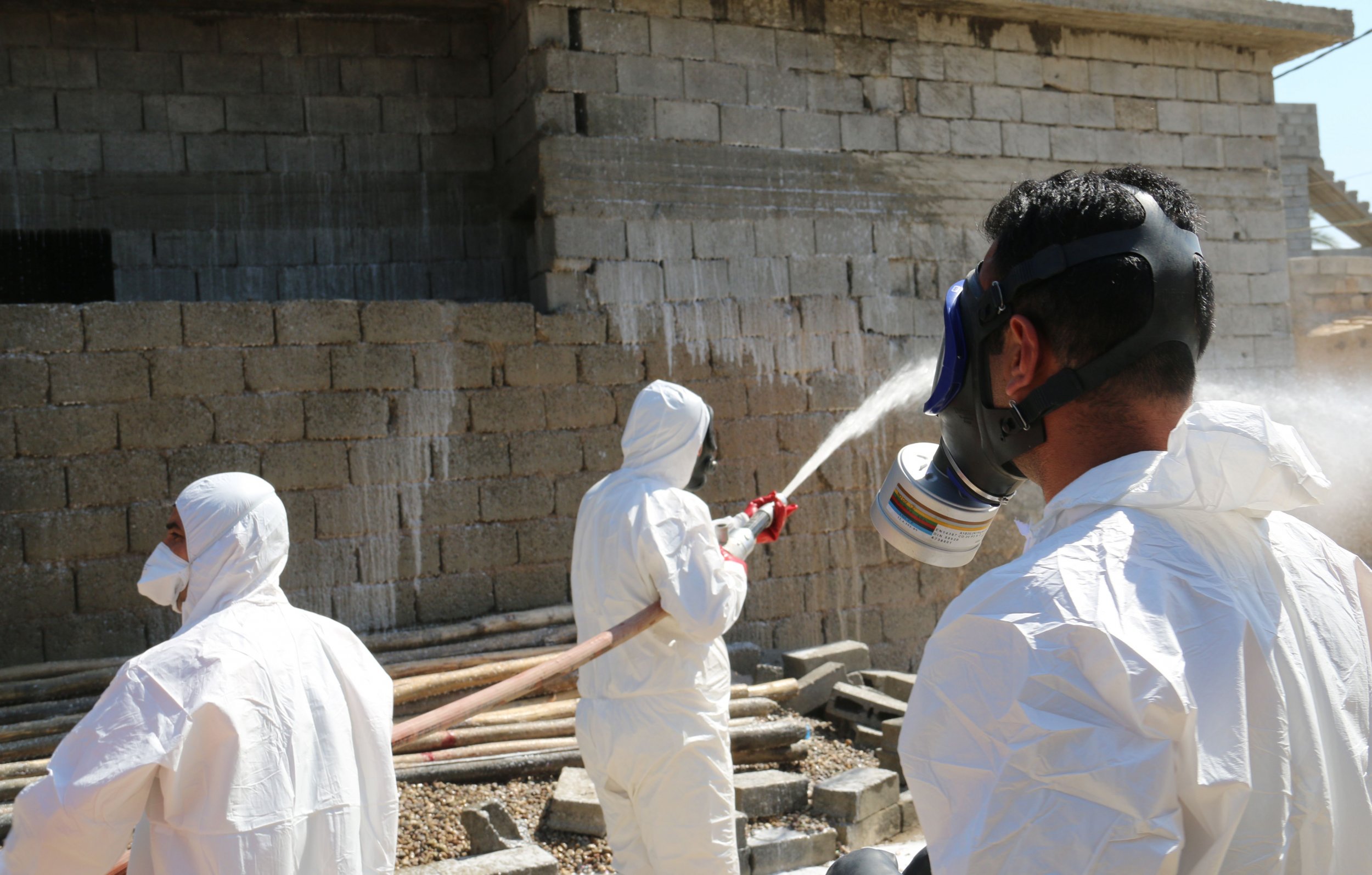 Iraqi civil defence spray areas