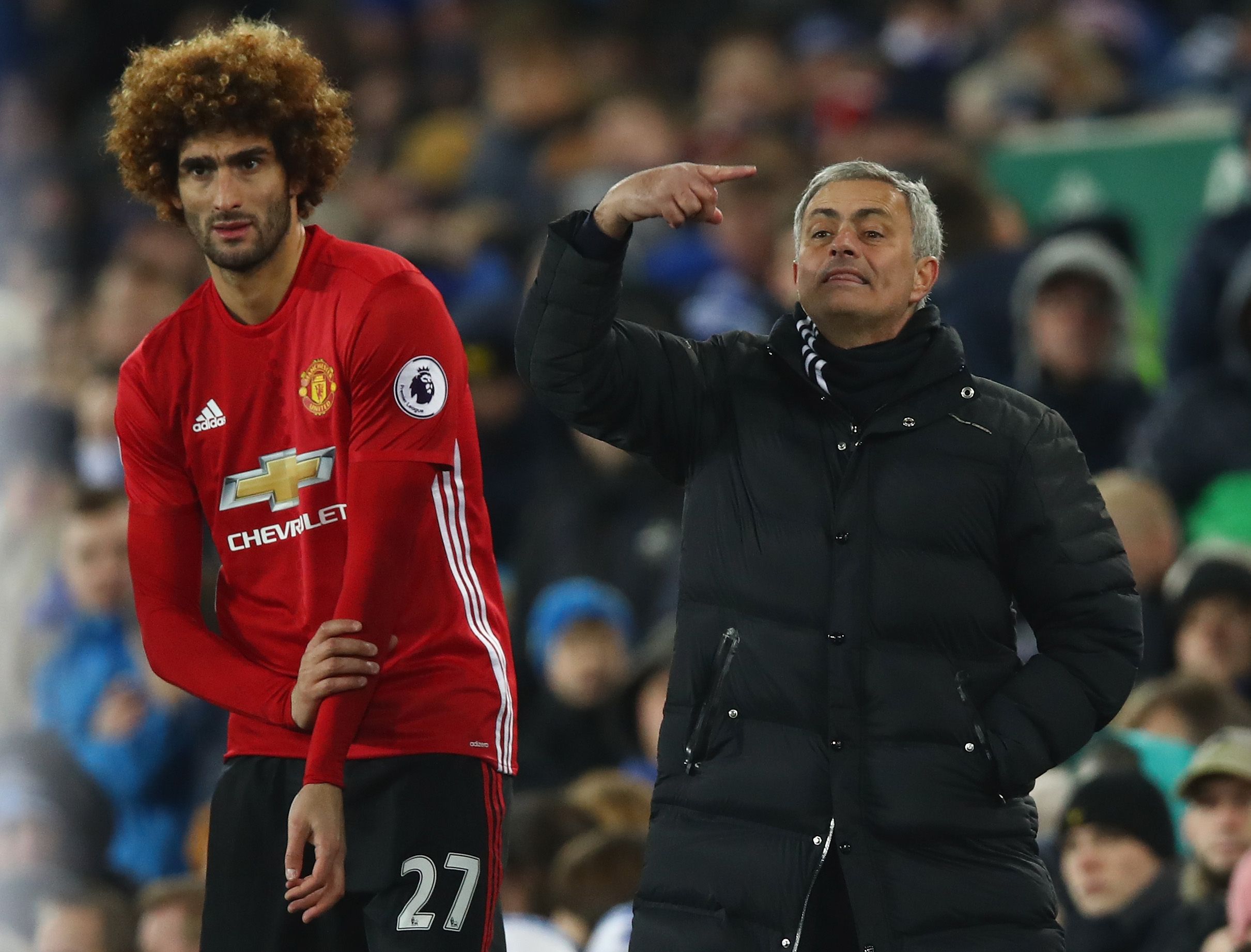 Manchester United's Marouane Fellaini, left, with Jose Mourinho.