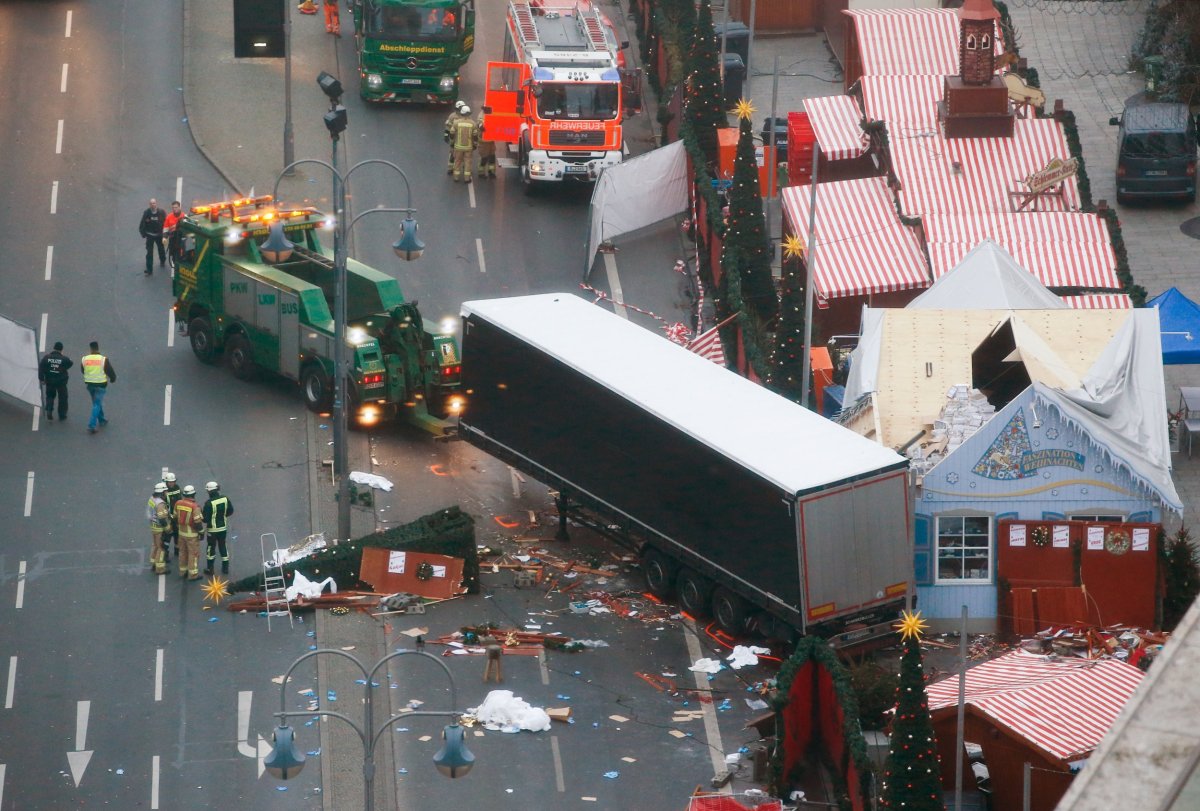 Rescue workers tow away the lorry from the Berlin attack