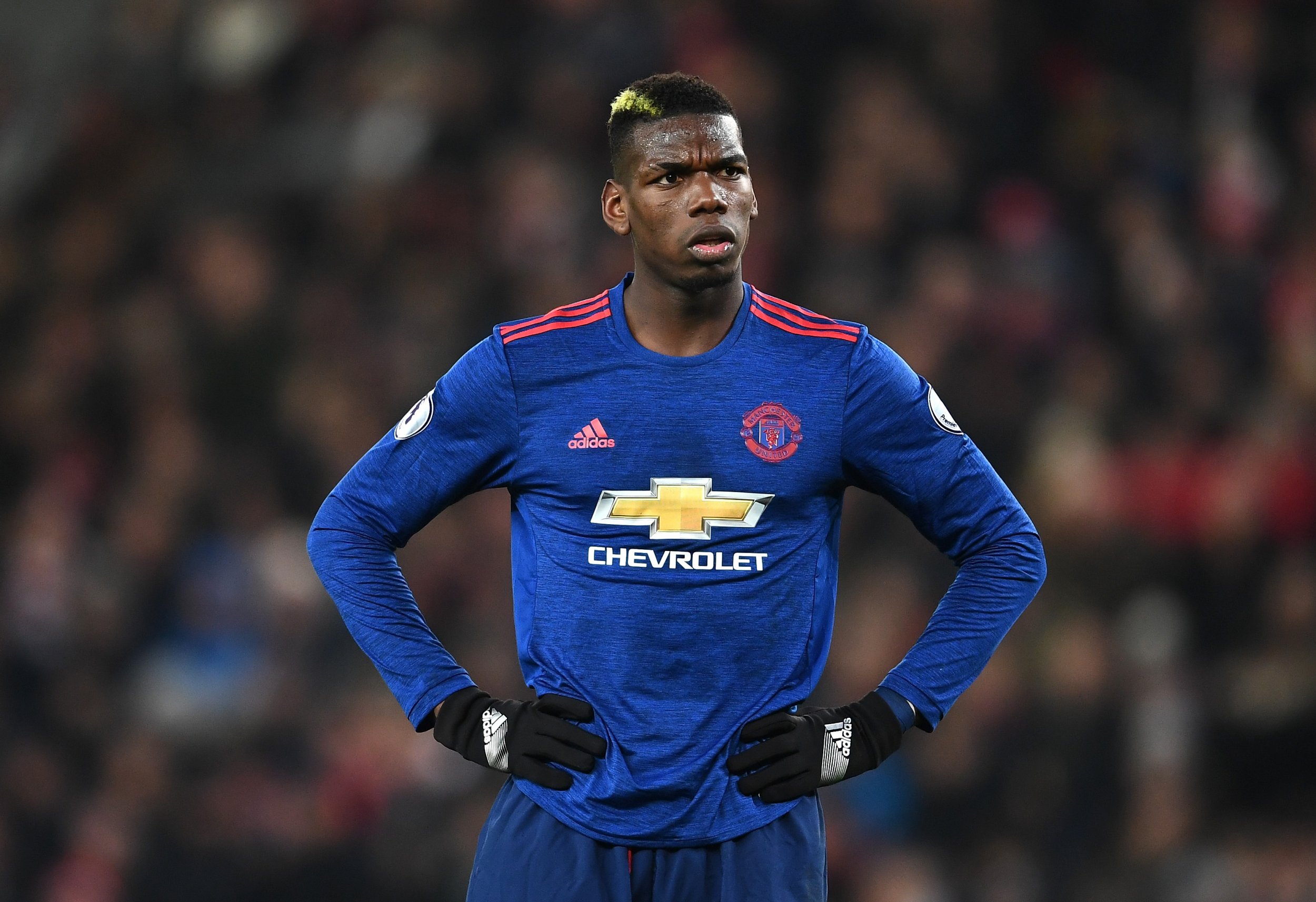 Manchester United's Paul Pogba pulls up is shirt during their English  Premier League soccer match between Manchester United and Crystal Palace at  Old Trafford in Manchester, England Saturday, Aug., 24, 2019. (AP