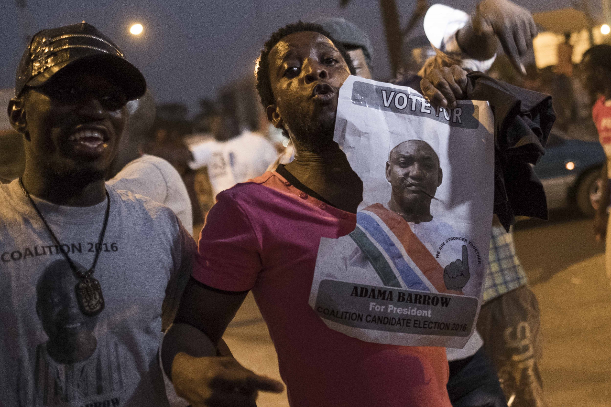 Gambians with Adama Barrow poster