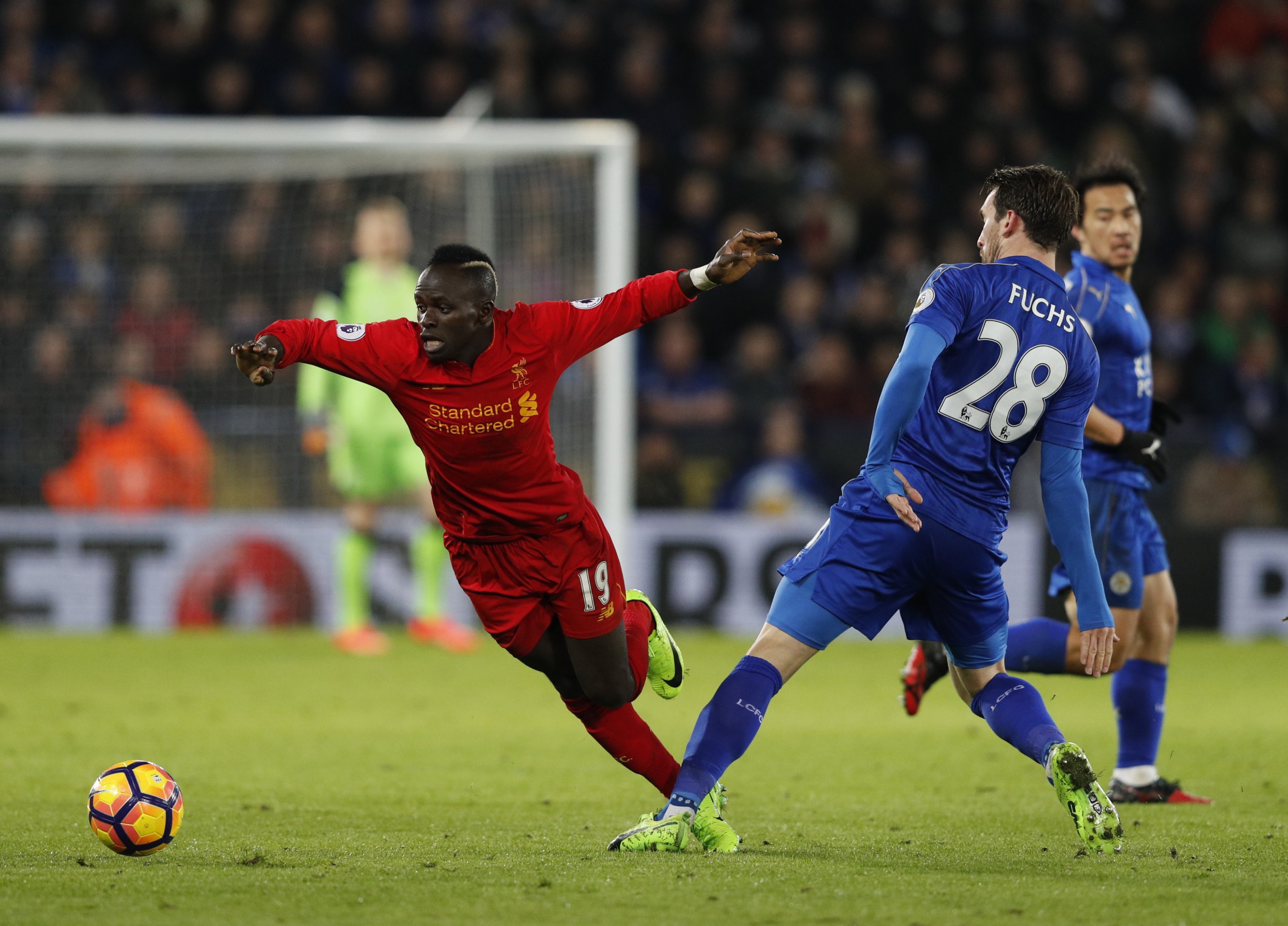 Liverpool's Sadio Mané, left, with Leicester City's Christian Fuchs.