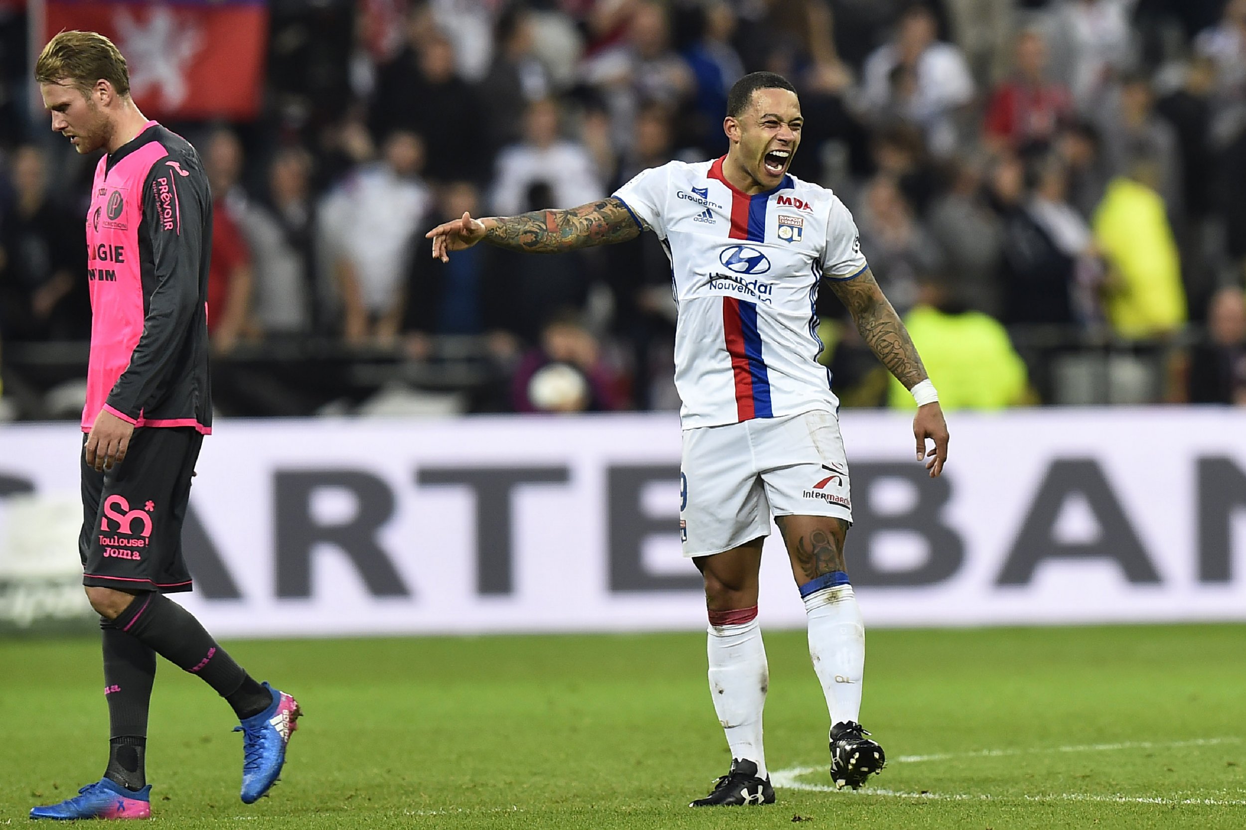 Manchester United winger Memphis Depay, right, on loan at Lyon.