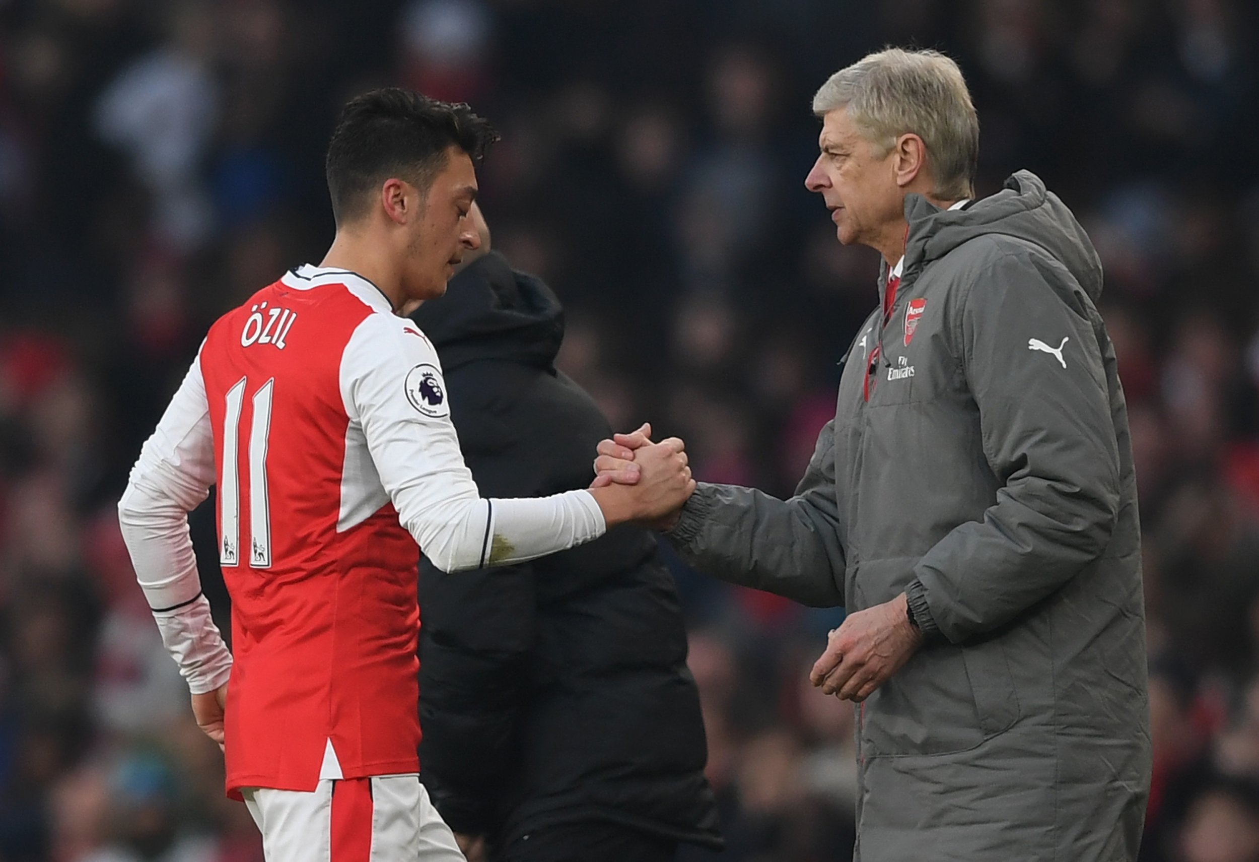 Arsenal star Mesut Ozil, left, with manager Arsene Wenger.