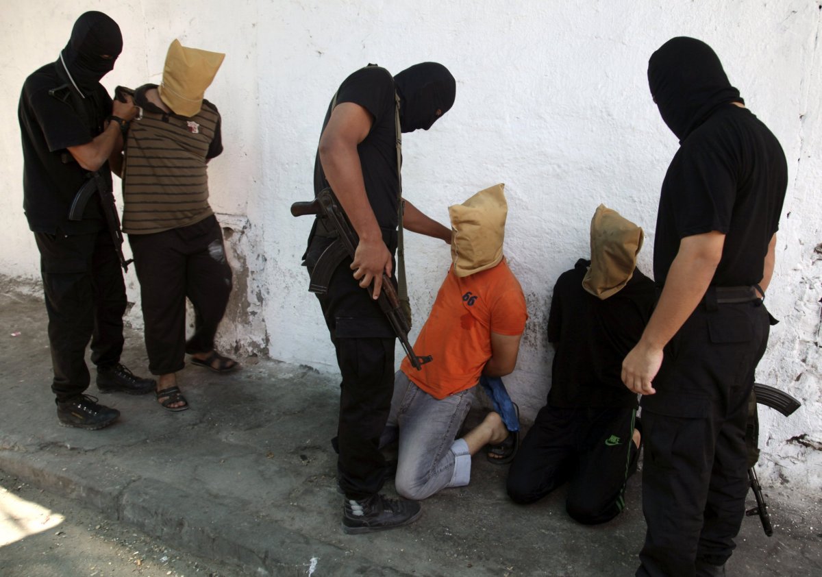 Hamas militants with suspected collaborators