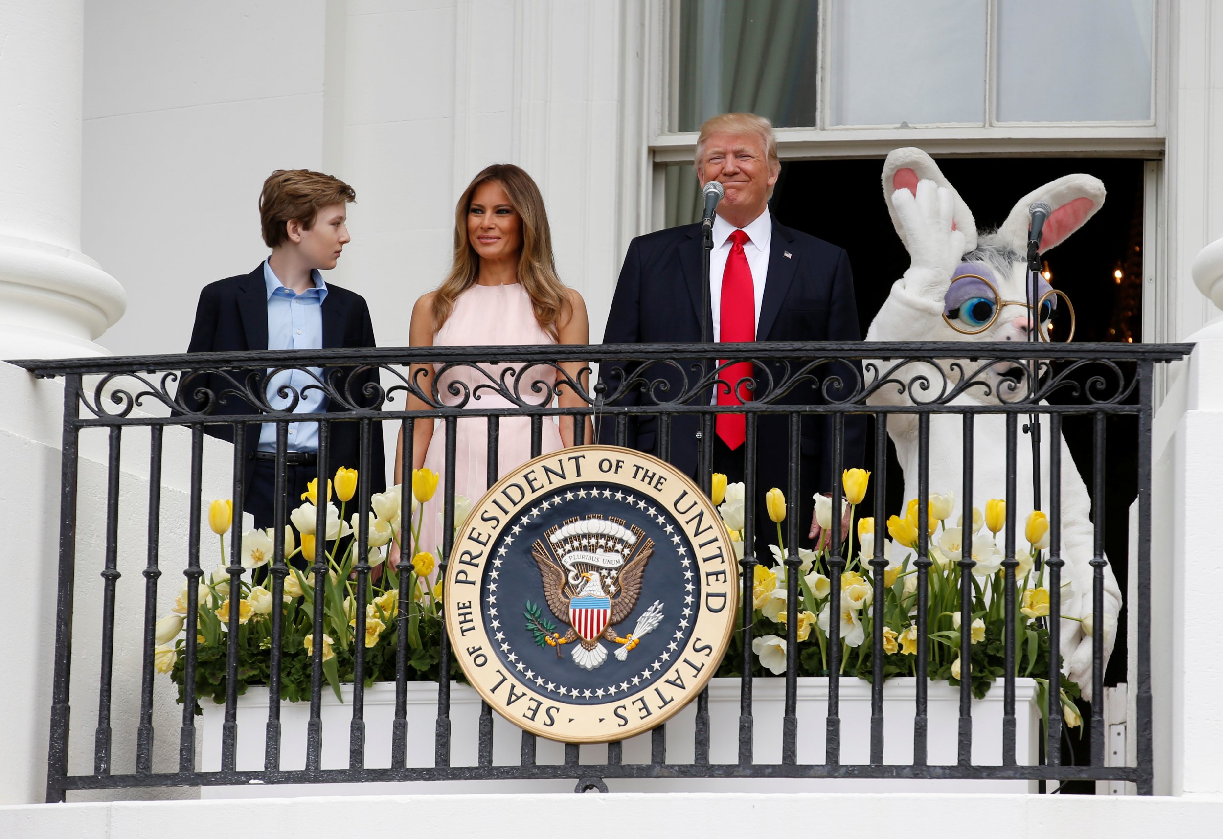 Barron Trump, far left, with parents Melania and Donald.