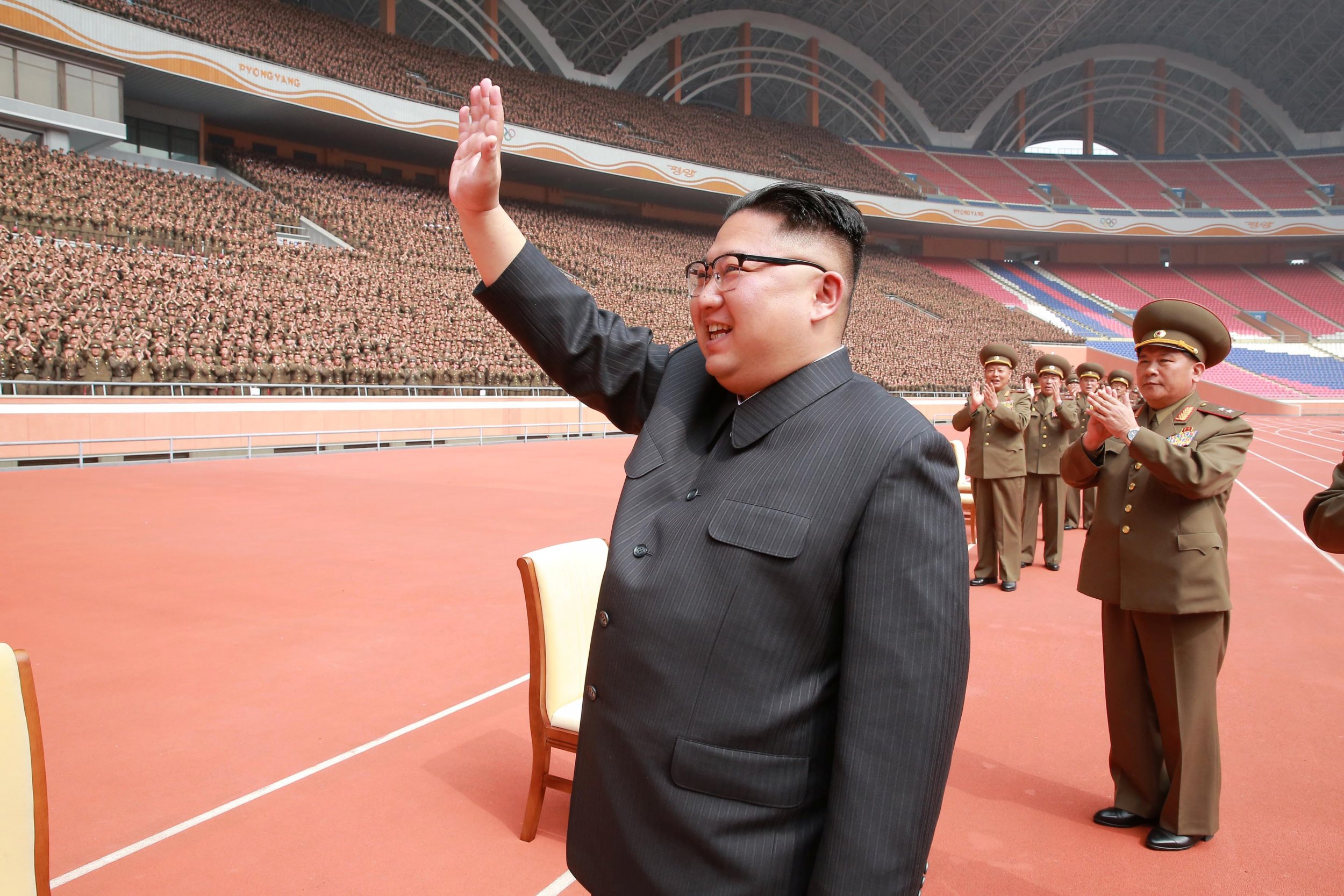 North Korean leader Kim Jong Un waves to the members of the Korean People&a...