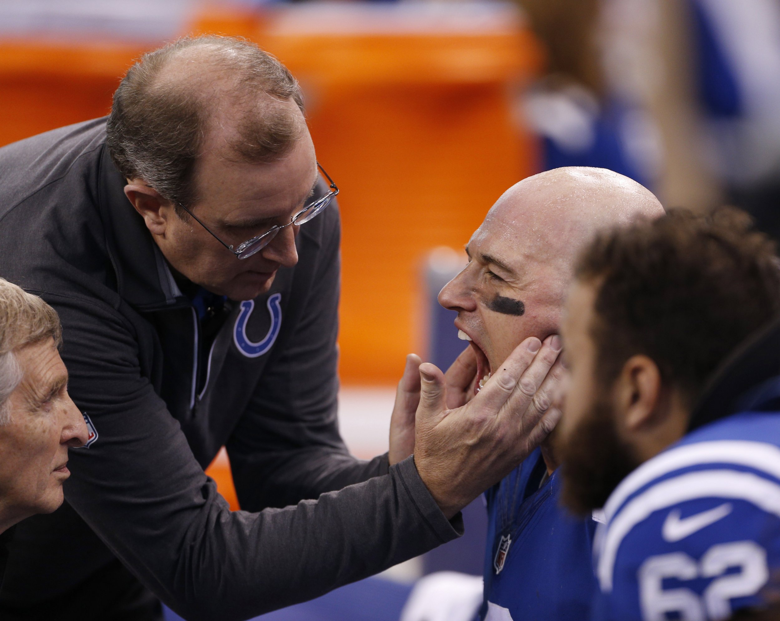 Former Indianapolis Colts quarterback Matt Hasselbeck (8) is examined by team doctors from the bench after being injured against the Houston Texans at Lucas Oil Stadium, Indianapolis, December 20 2015.