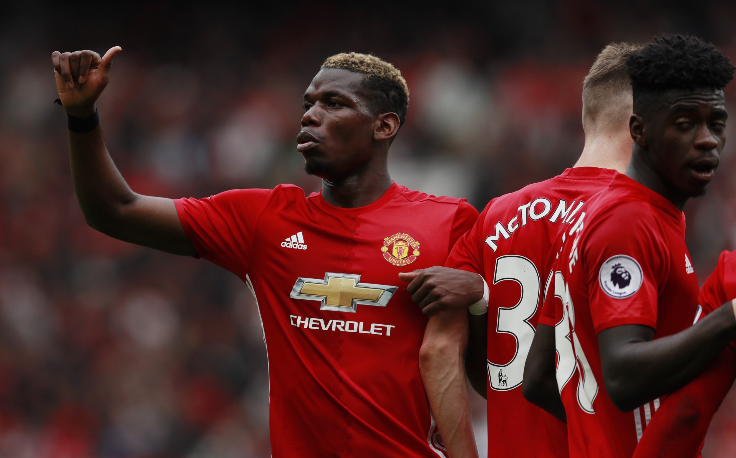 Manchester United midfielder Paul Pogba, left.