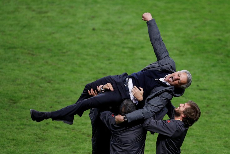 Manchester United manager Jose Mourinho celebrates with coaching staff at Friends Arena, Stockholm, May 24.