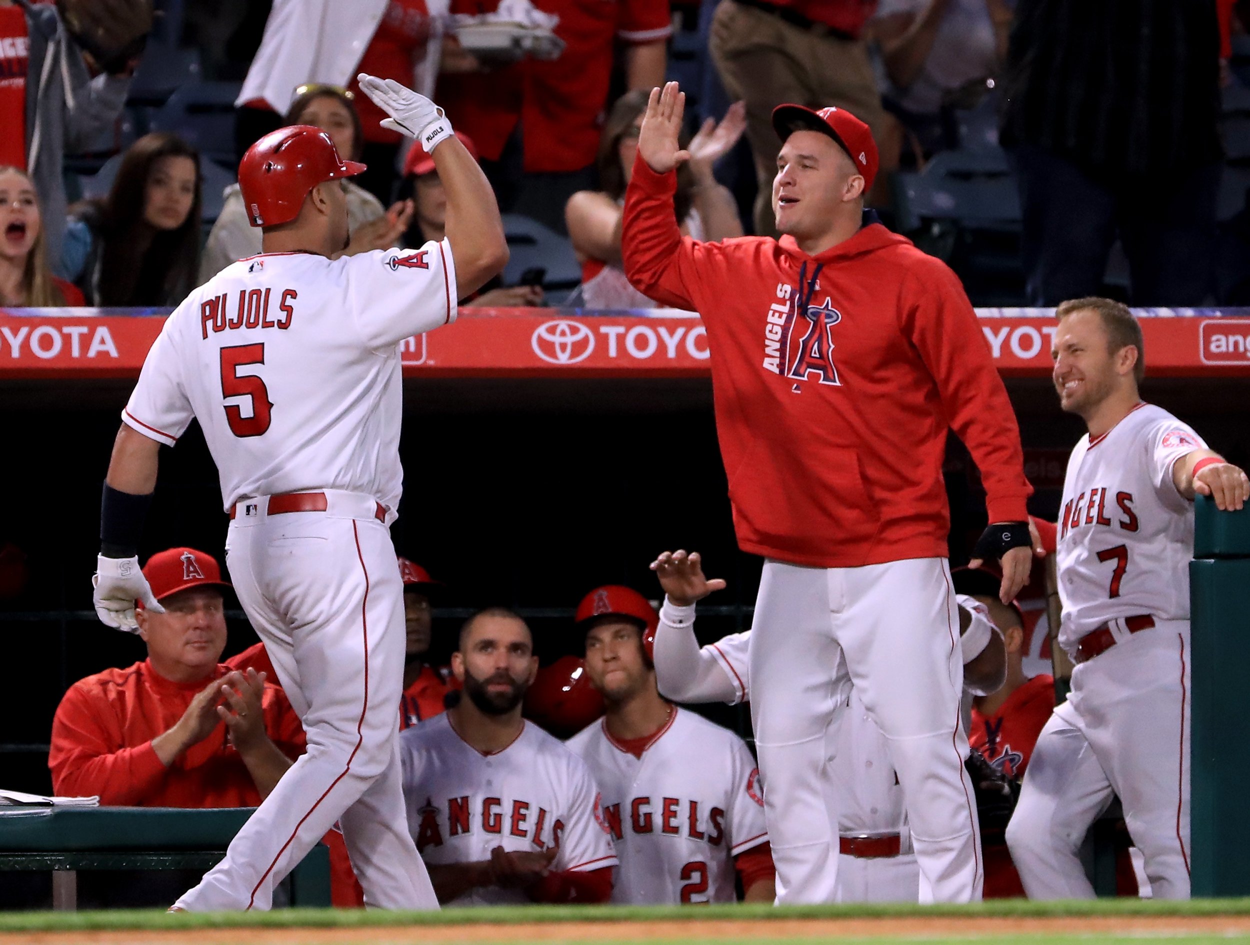 Pujols and Champ hug it out, 11/30/2017