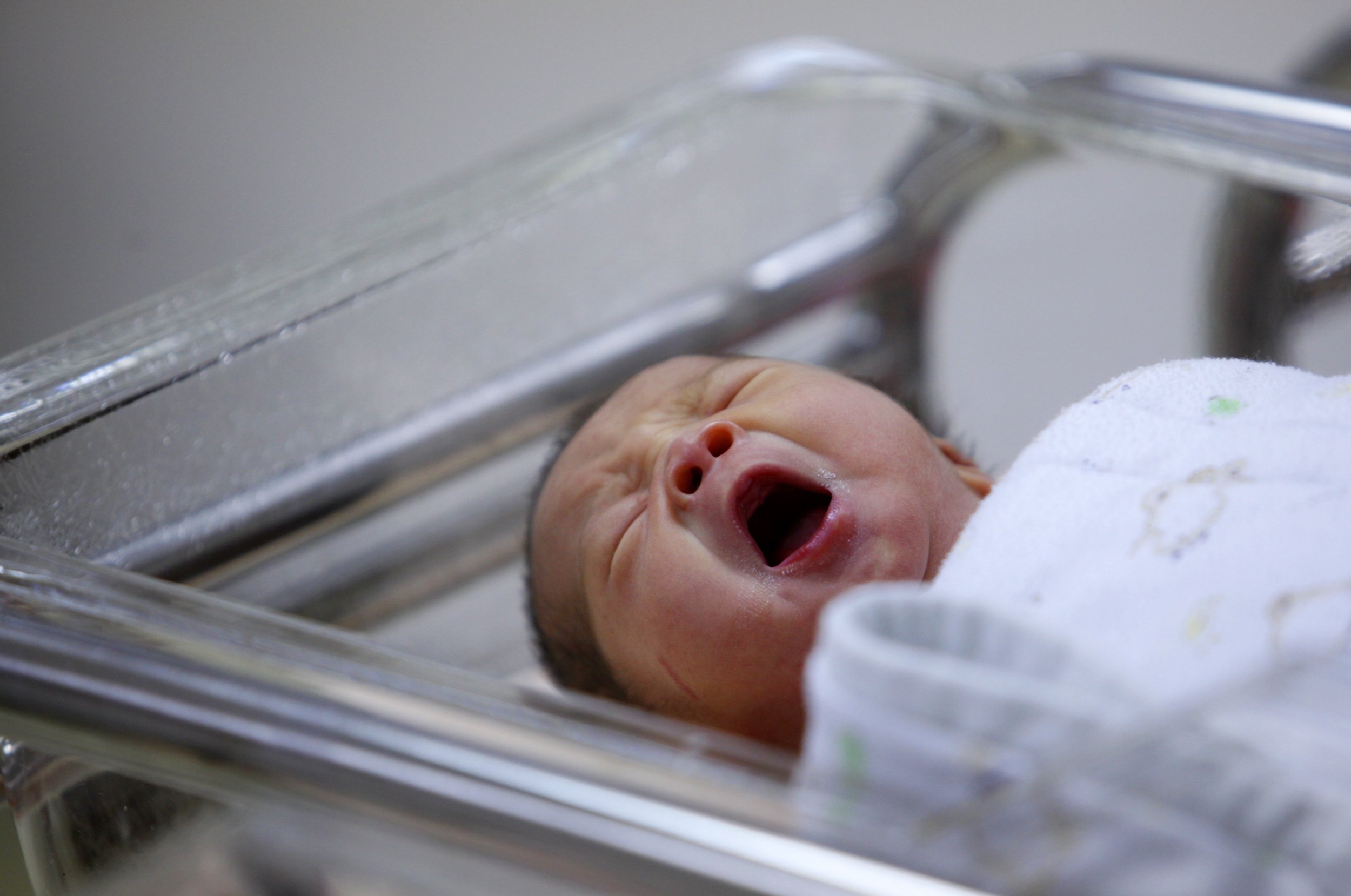 Baby in a cot