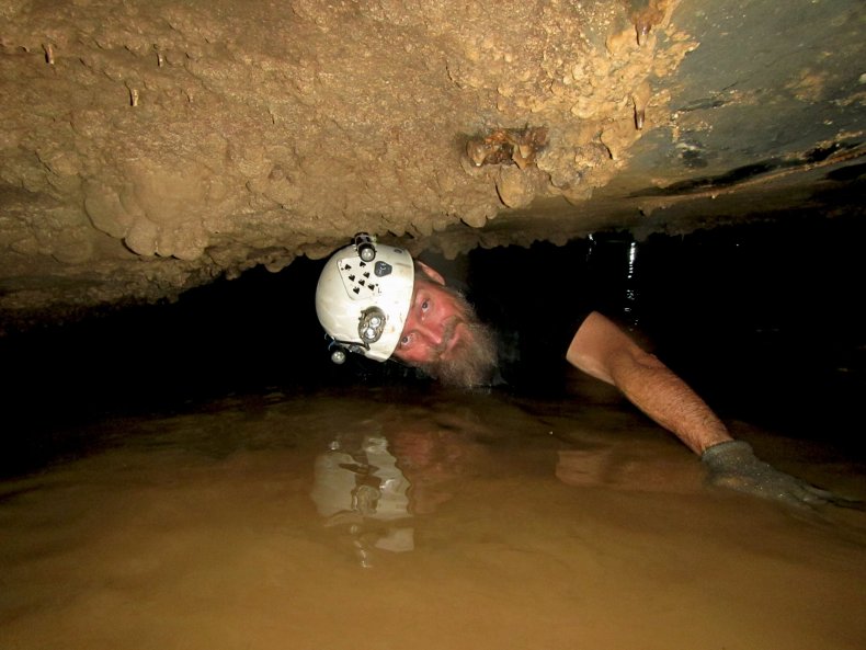 Dr Fenolio exploring a Chinese cave, image by Andy Gluesenkamp