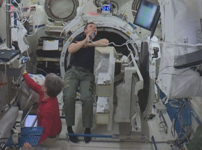 ISS astronauts with drone