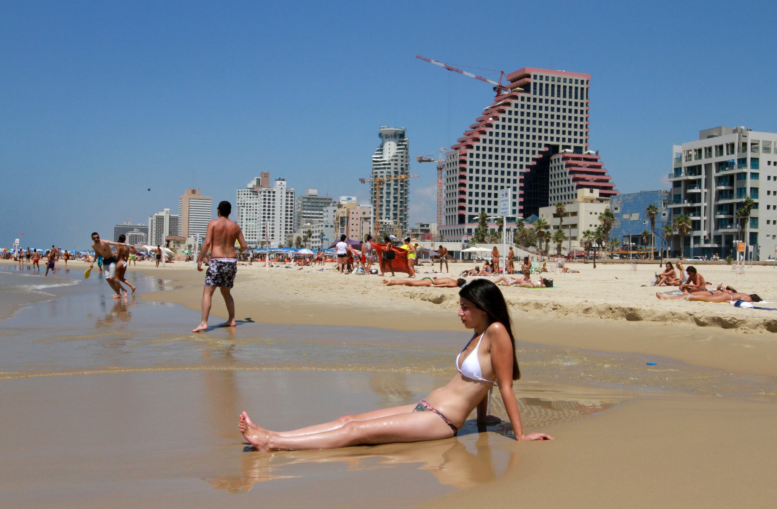 A woman on the beach in the Israeli city of Tel Aviv on August 11, 2015. 