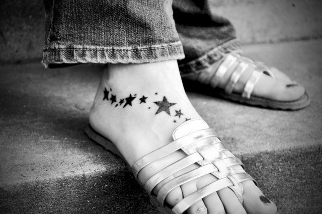 Woman with tattoo on feet