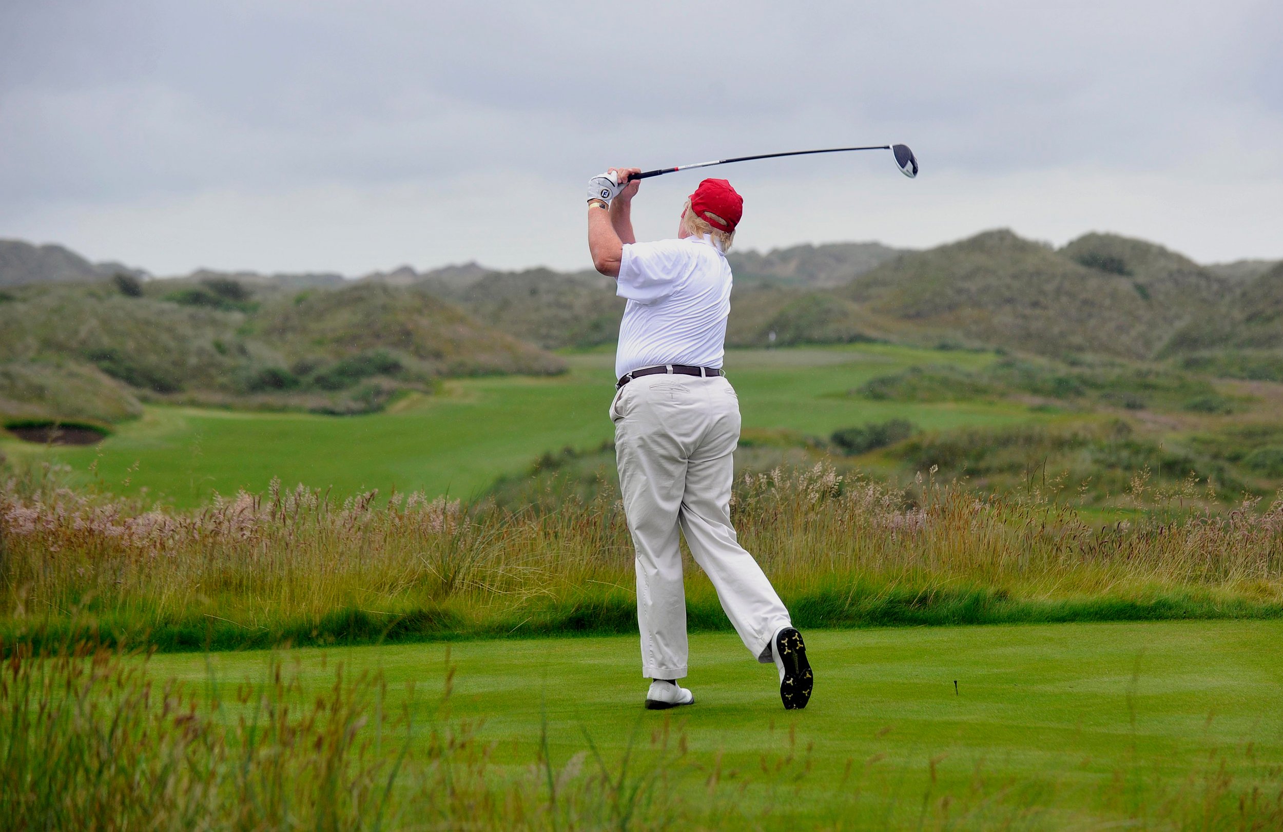 Donald Trump golfing, driving in Scotland