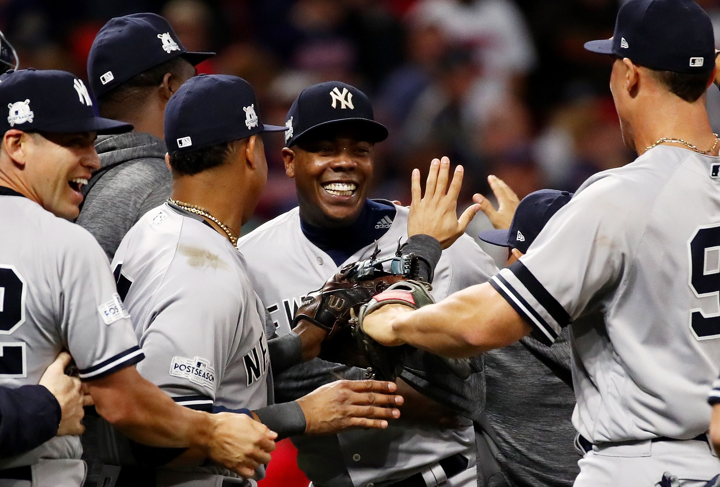 Yankees closer Aroldis Chapman, center, celebrates the ALDS victory over the Cleveland Indians.