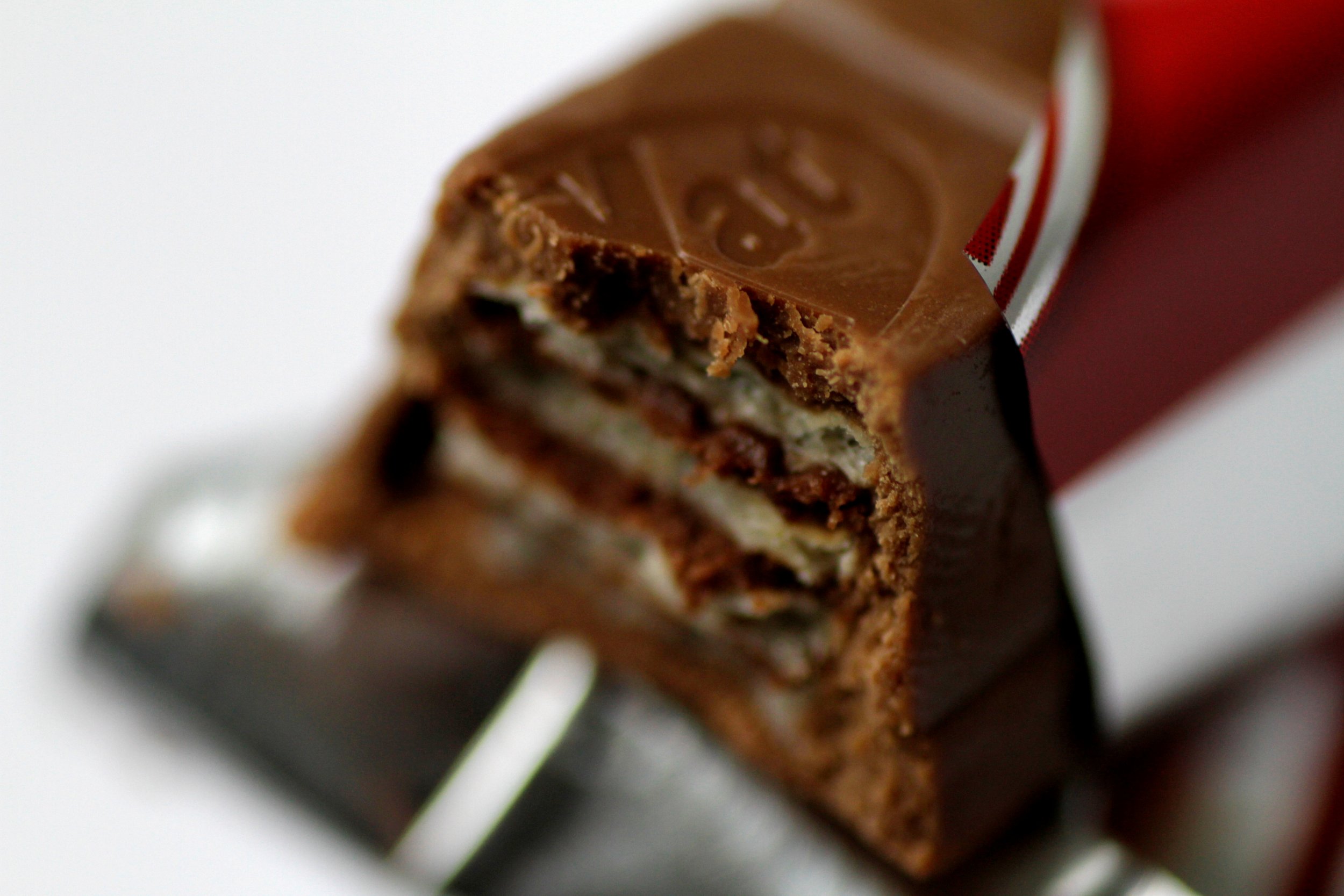 Family eating chocolate bar as they pose for the picture Stock Photo |  Adobe Stock