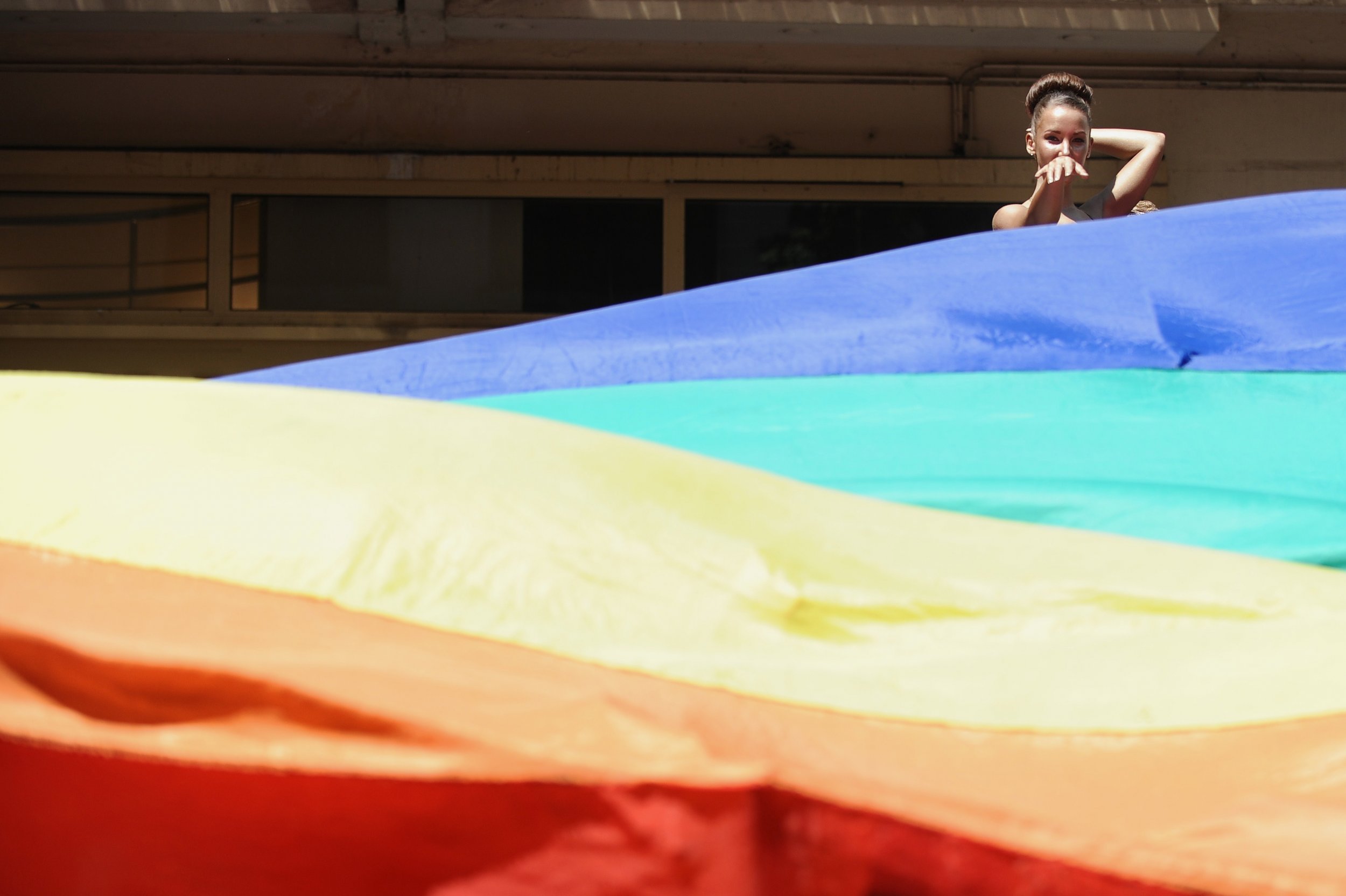 gay men flag dancing