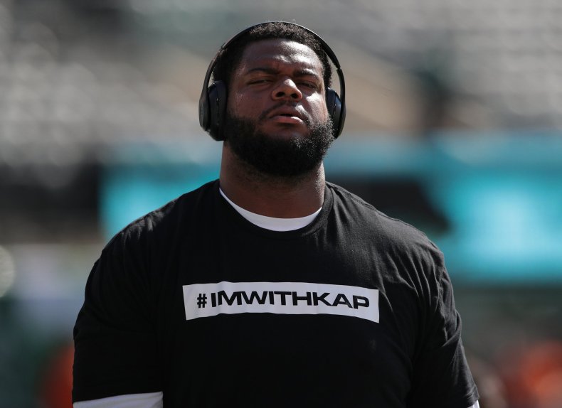 Jordan Phillips of the Miami Dolphins wears a t-shirt in support of former NFL quarterback Colin Kaepernick in East Rutherford, New Jersey, September 24.