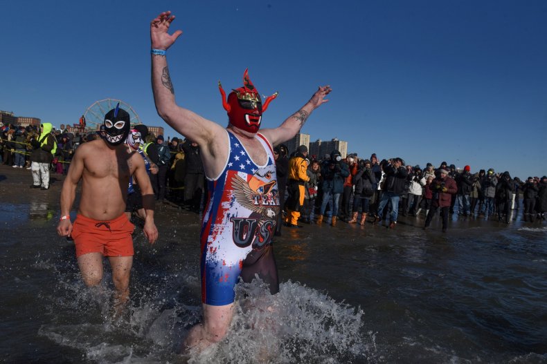 PHOTOS New Year's Day Polar Bear Plunges Carry On Despite Bitter Cold Temperatures