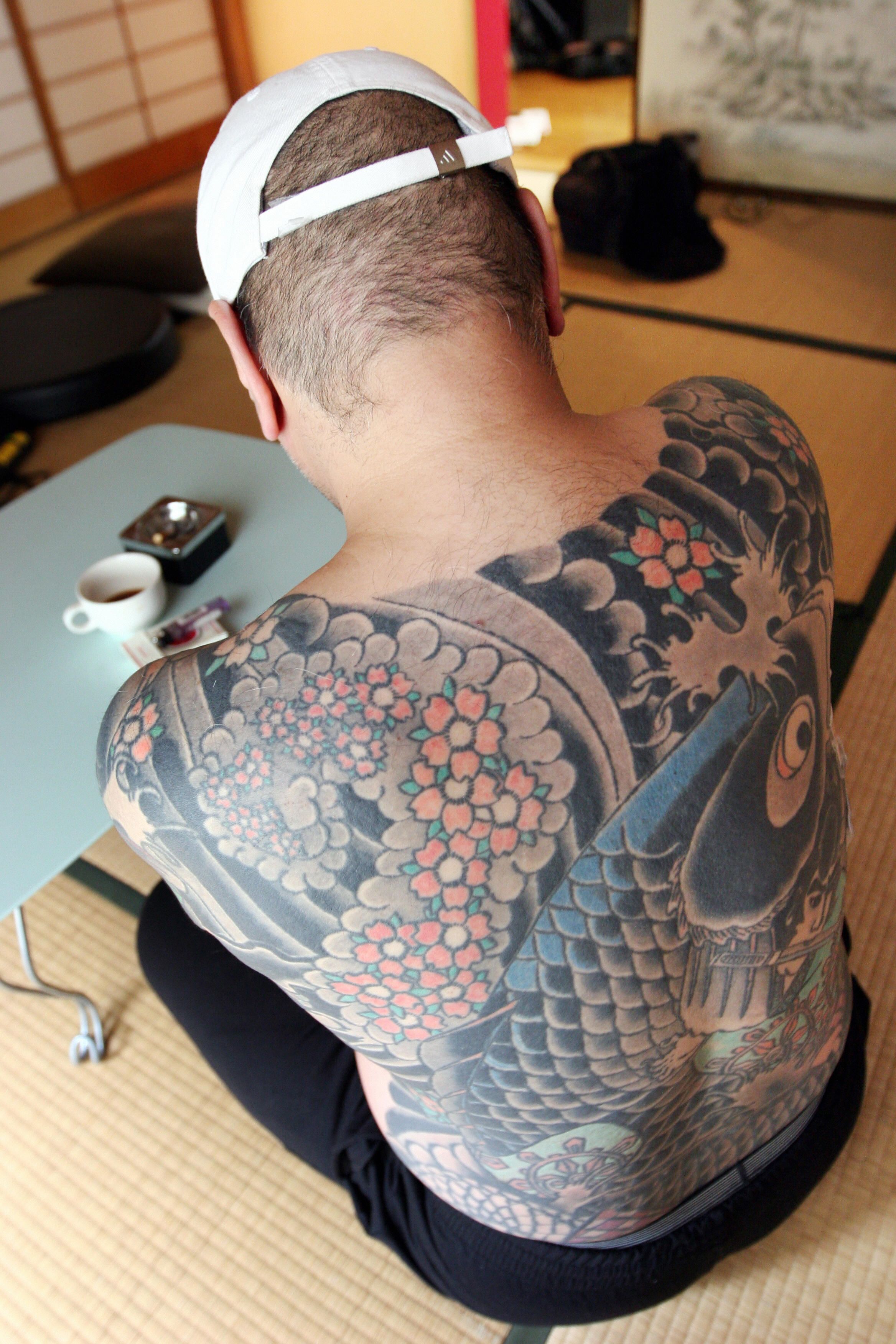 Fugitive from Japanese yakuza gang is given away by tattoos