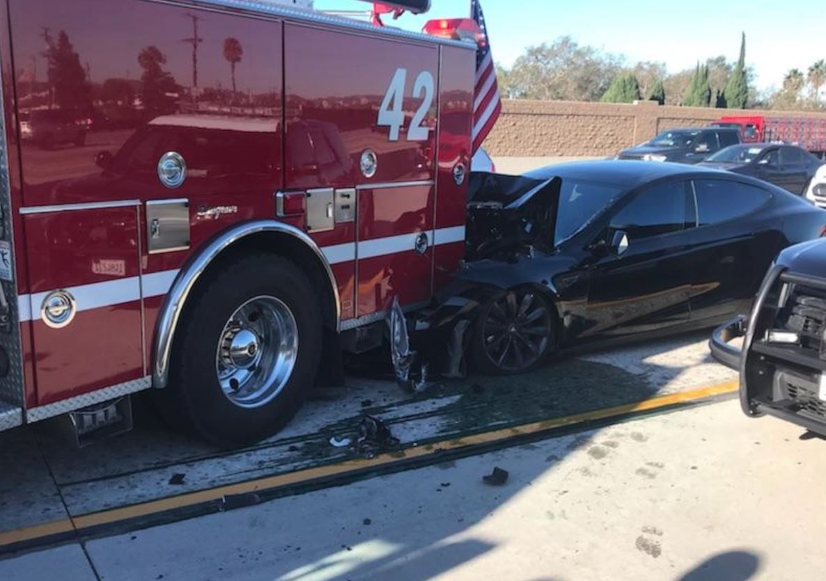 Semi Autonomous Tesla Crashes Into Parked Fire Truck On