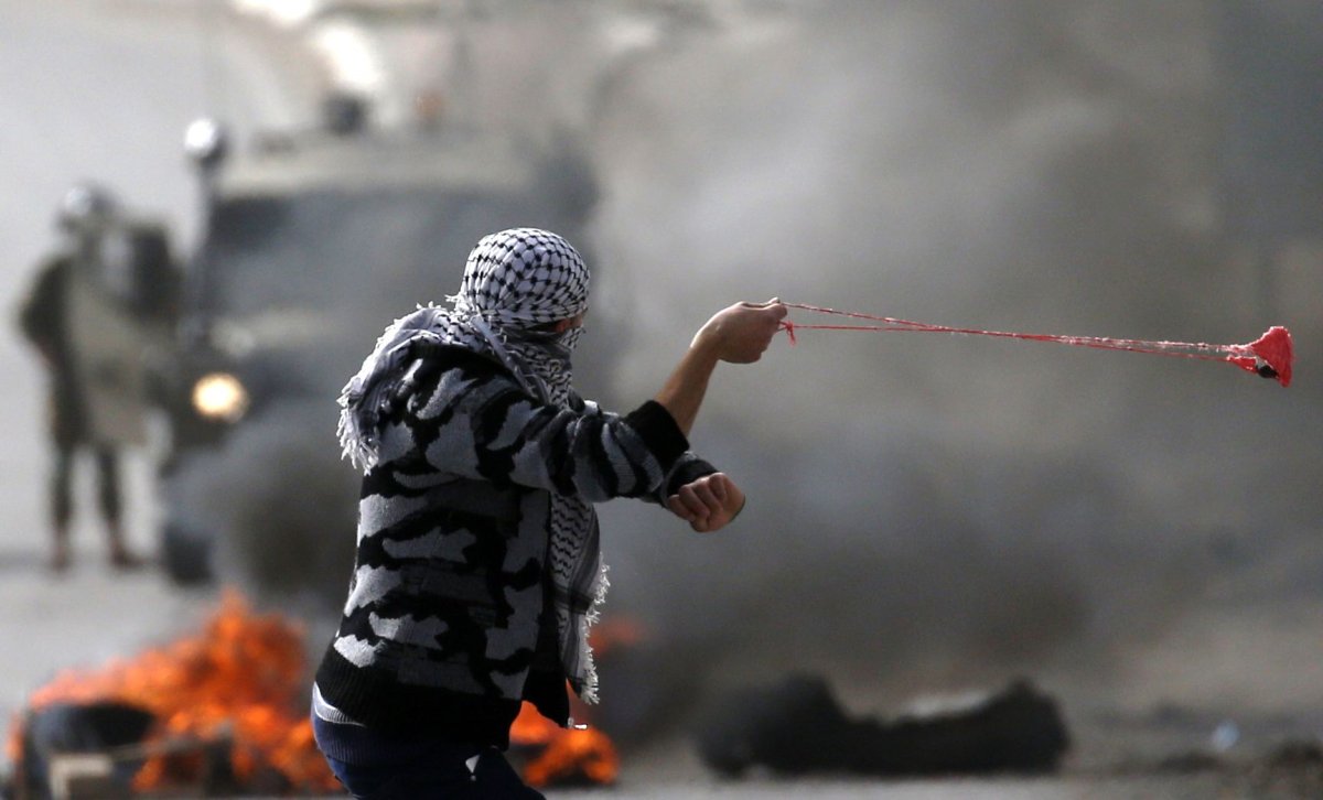Palestinian man with slingshot in protests against Israeli forces in the West Bank