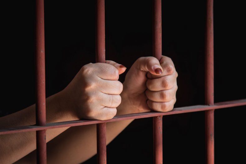 prison-woman-female-hands-stock