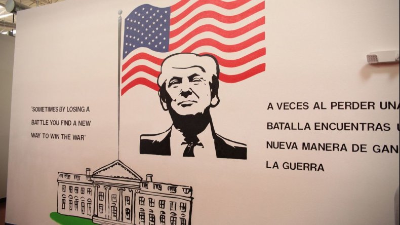 A mural of Trump at a child immigration detention center reads “sometimes losing a battle you find a new way to win the war," in Brownsville, Texas.