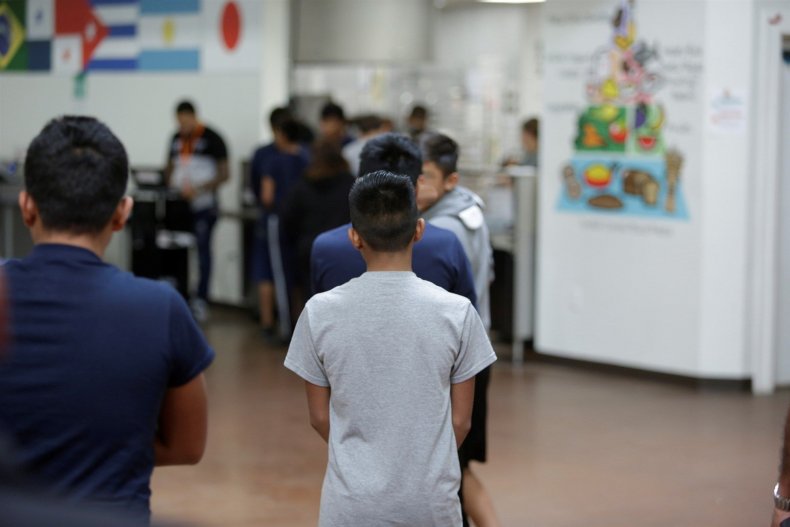 Migrant children stand in line at Casa Padre in Brownsville, Texas, on Wednesday.