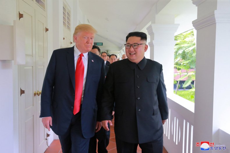 U.S. President Donald Trump walks with North Korean leader Kim Jong Un at the Capella Hotel on Sentosa island in Singapore in this picture released on June 12